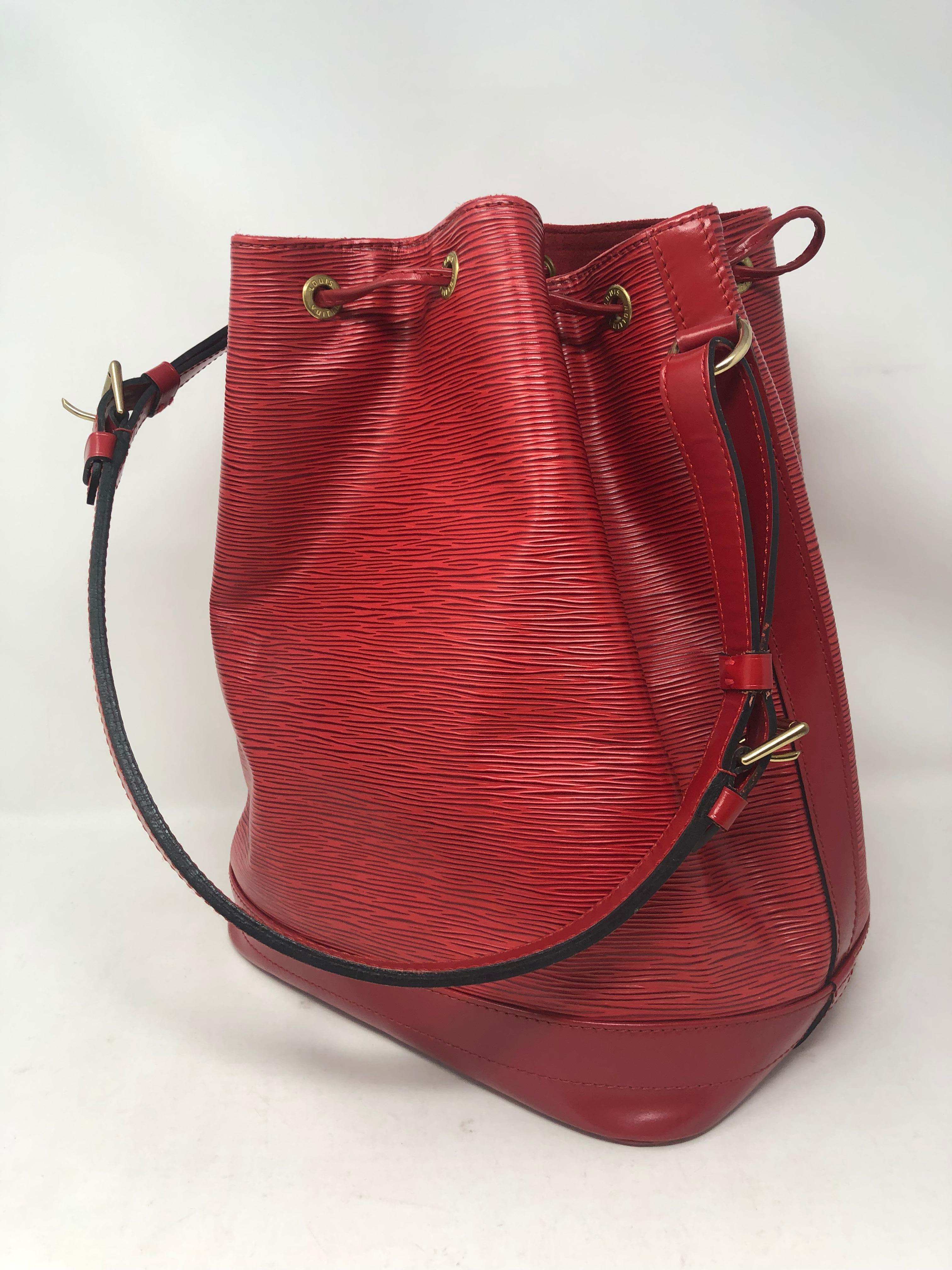 Louis Vuitton Red Epi Noe Bag. Larger size bucket style bag. Red epi leather is durable and in excellent condition. Retired color from LV. Own this beautiful bag today. Guaranteed authentic. 