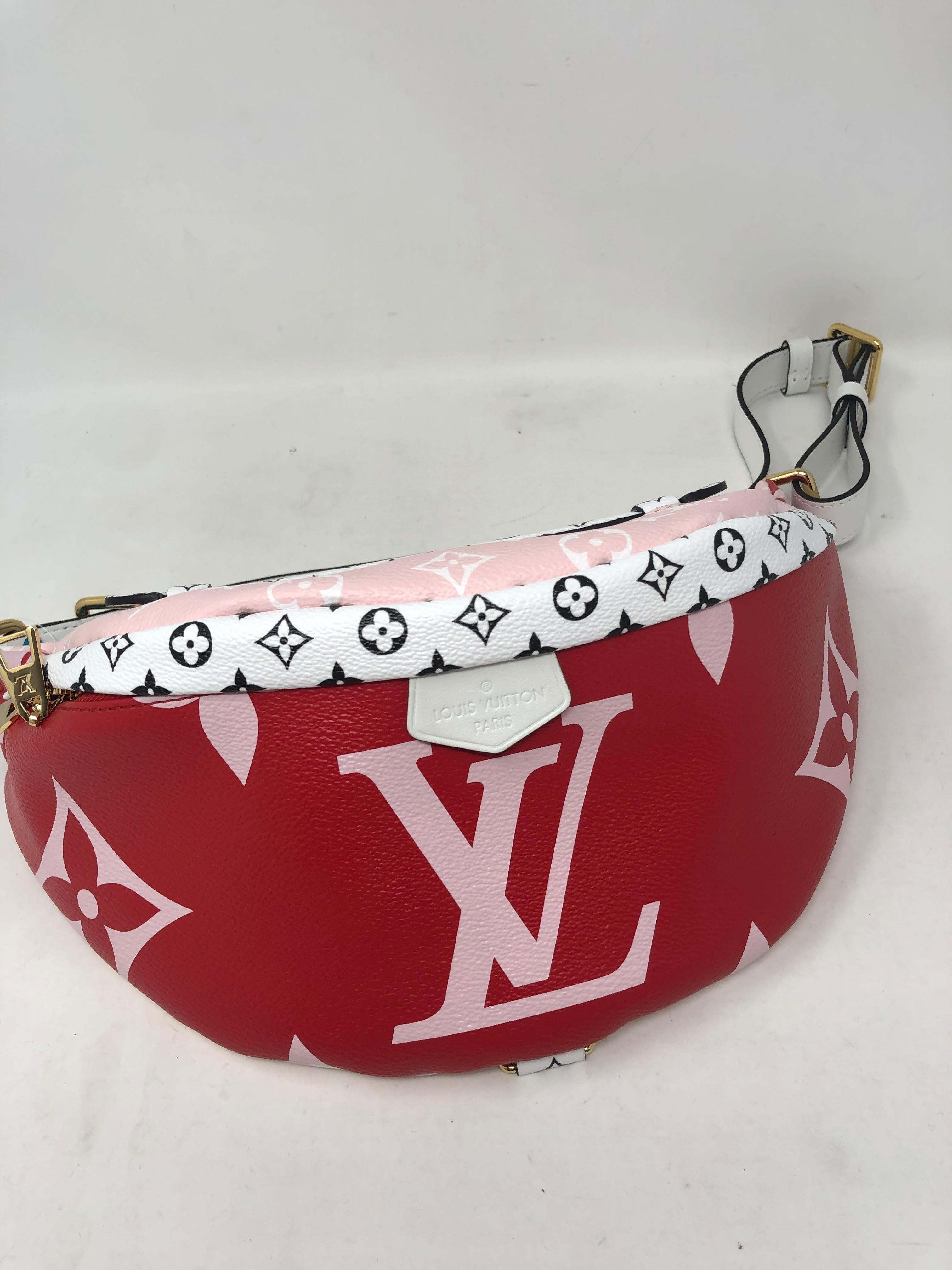 Louis Vuitton Red Giant Bum Bag. Brand new and limited. Unique design with red, pink, white and black small monogram details. Beautiful bag that can be worn as a fanny pack or across the body. Guaranteed authentic. 