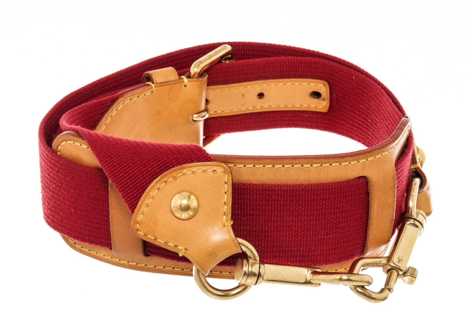 Louis Vuitton Red Leather Adjustable Strap with leather, tan vachetta leather, turn lock closure.
61205MSC