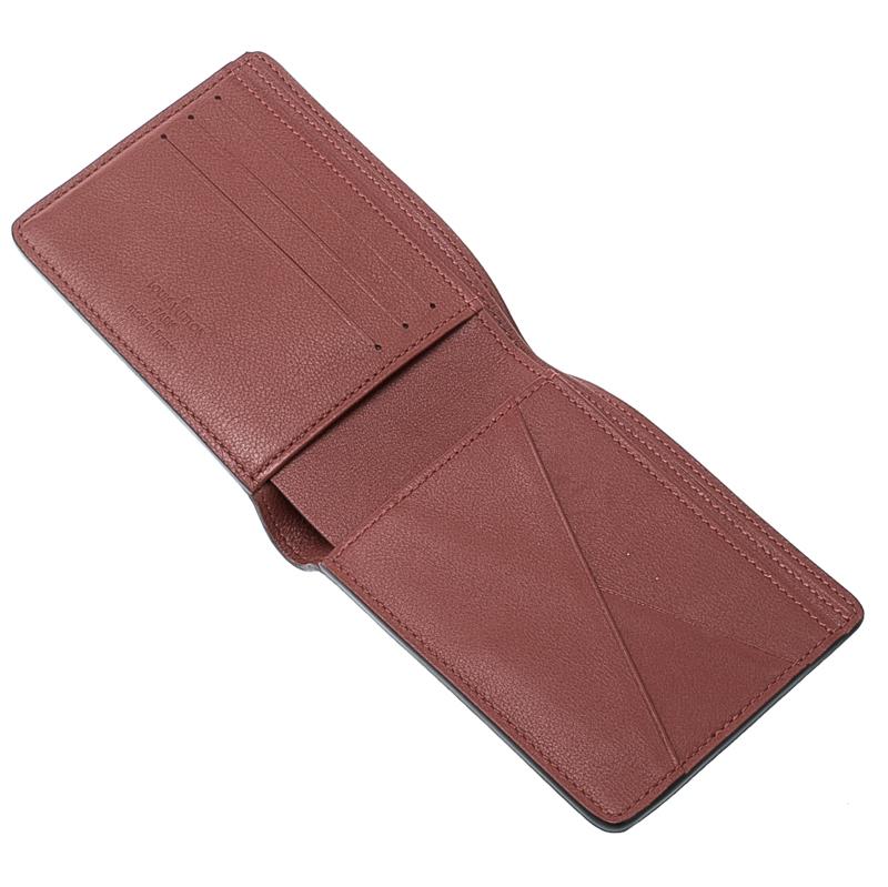 This classic piece is the statement accessory you must have in your closet. Crafted to perfection, this bi-fold wallet from Louis Vuitton is made with red leather and has a complementing leather interior. With various card slots and two