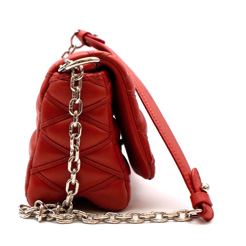 Louis Vuitton Red Leather Twist Quilted Mini Bag 

-Iconic twist logo fastening to the front 
-Luxurious soft quilted leather 
-Rich warm red hue 
-2 Level chain shoulder strap with leather handle 
-Branded mirror with its own compartment and still