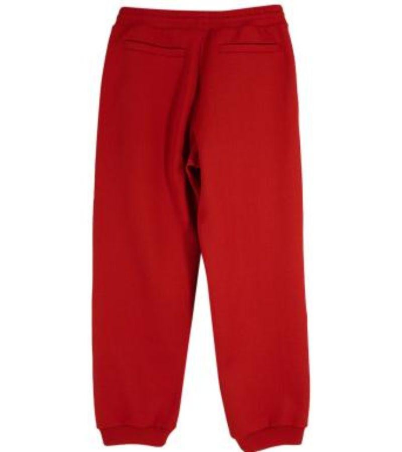 Women's Louis Vuitton Red Monogram Embossed Track Pants For Sale