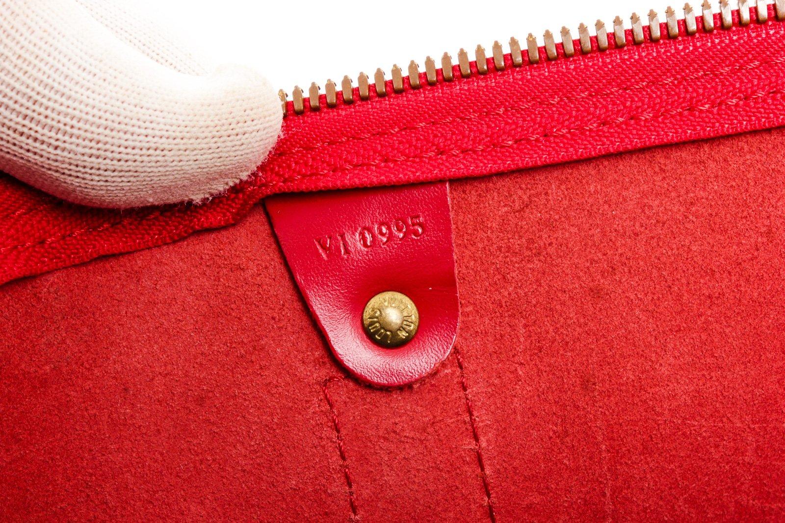 Louis Vuitton Red Monogram Epi leather Keepall 50cm Shoulder Bag with silver-tone hardware, tan vachetta leather trim, interior zip pockets, top handle, zip closure.

26524MSC