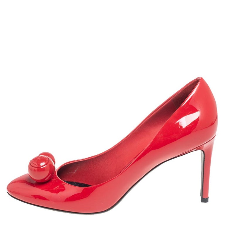 These lovely pumps from Louis Vuitton are an ideal choice as they are stylish and comfortable. They are made of red patent leather and designed with round embellishments on the vamps. This grand pair is elevated on sturdy heels.

Includes: Original
