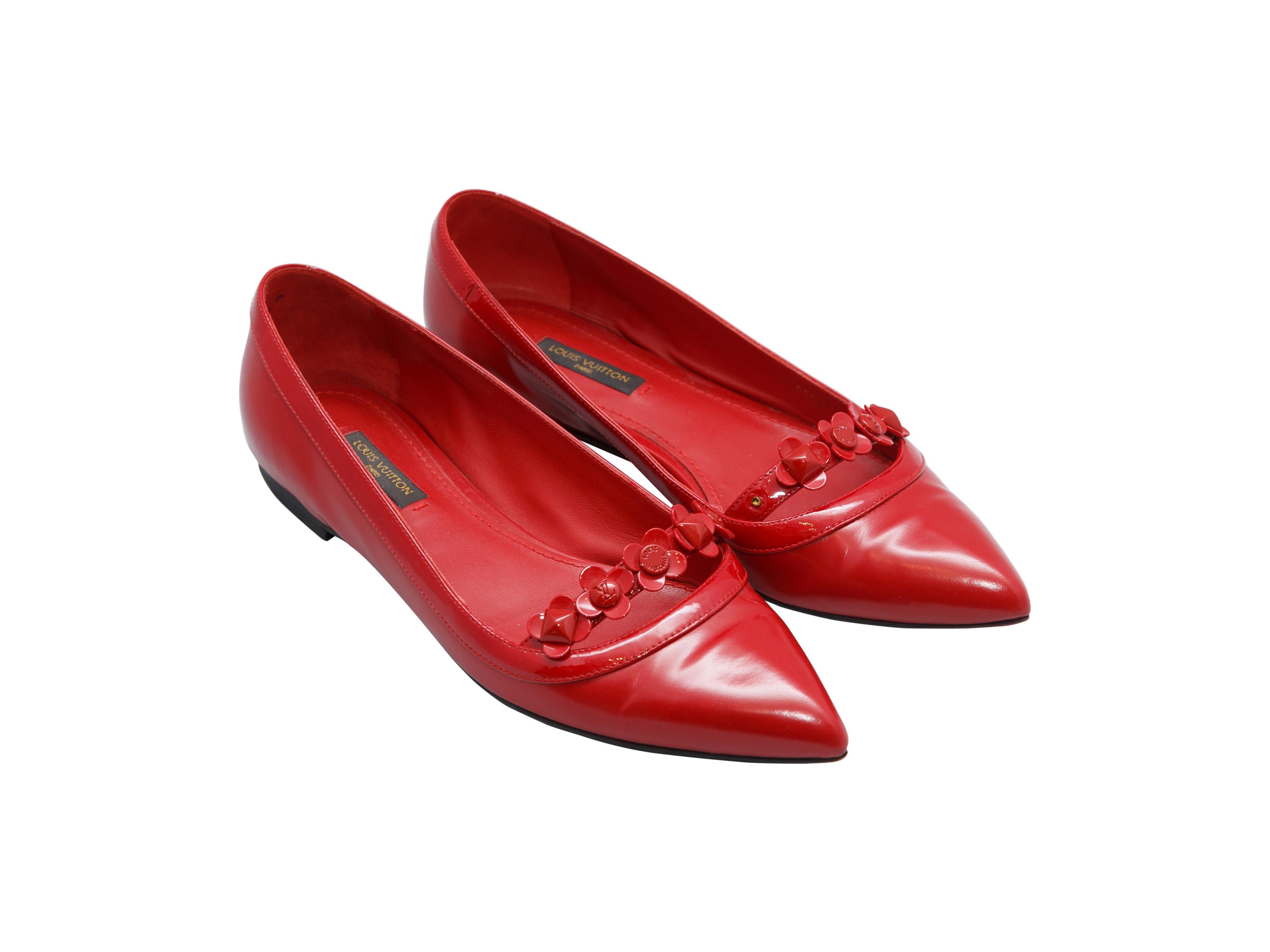 Product details: Red leather pointed-toe ballet flats by Louis Vuitton. Floral embellishments at toes. Designer size 36.5.
Condition: Pre-owned. Good. Missing embellishments at left shoe.
Est. Retail $ 795.00
