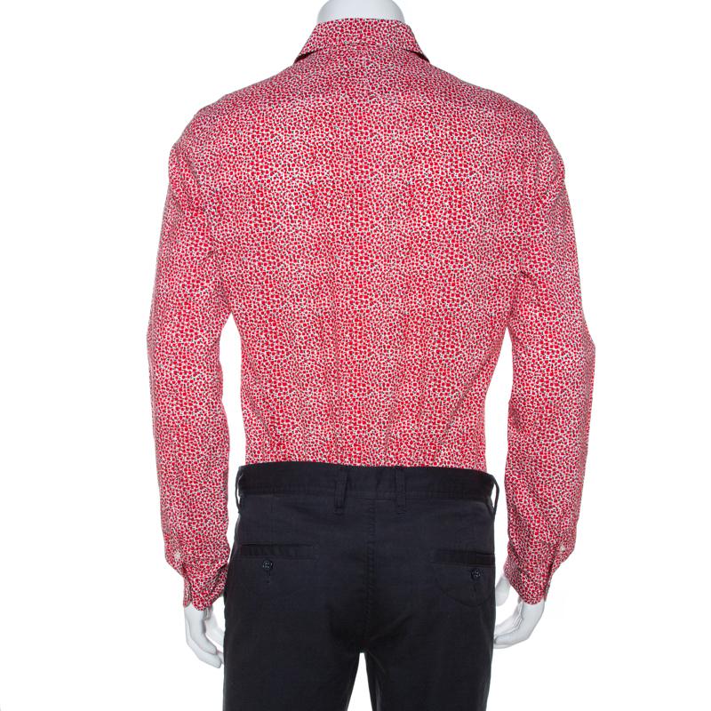 Step out in style with this one-of-a-kind shirt from the iconic house of Louis Vuitton. Crafted from 100% cotton, it is comfortable and breathable. It carries a red print throughout that adds interest. It is perfect for casual occasions and will