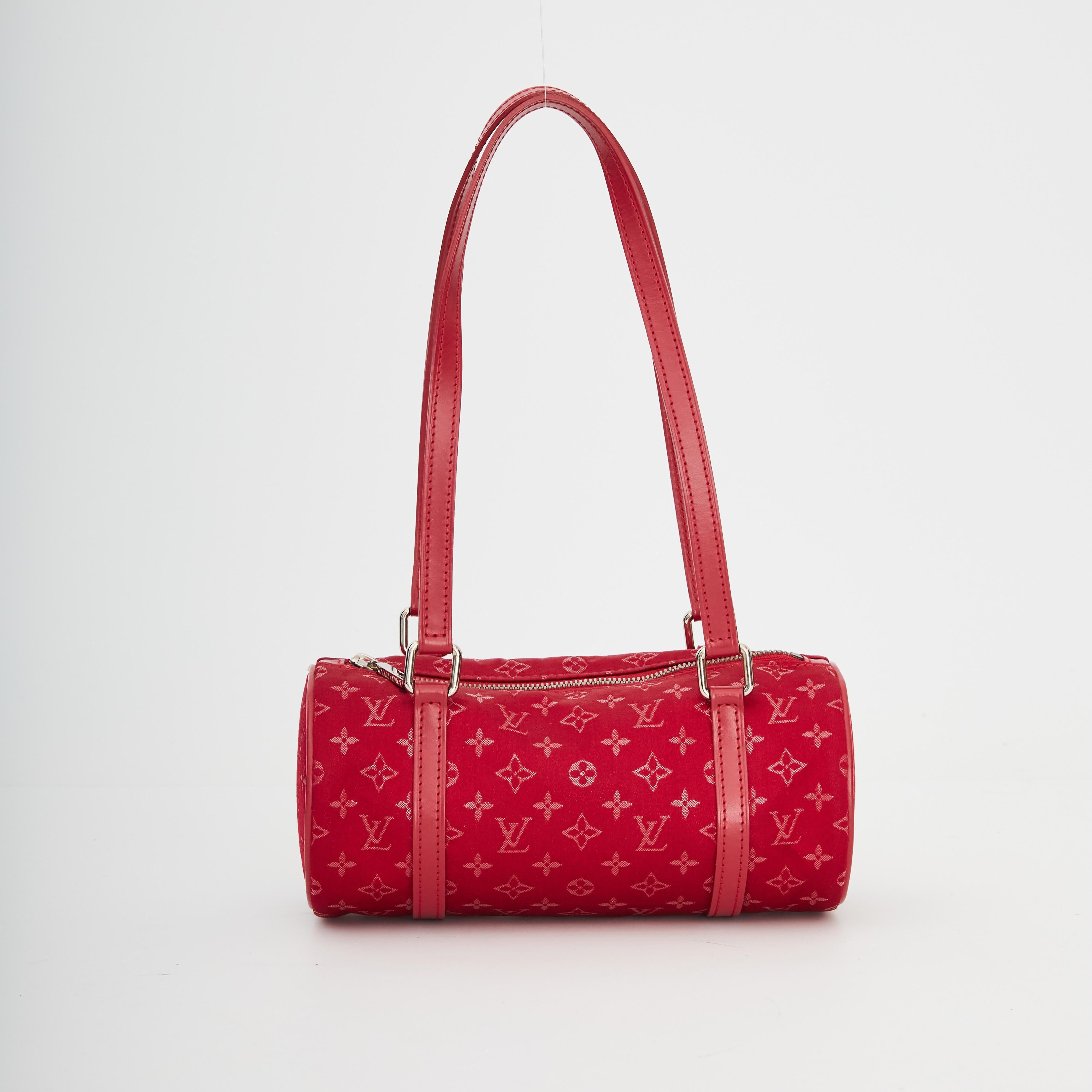 Louis Vuitton pre-loved mini Papillon handbag in a red monogram satin featuring red leather flat top handles, rolled leather trim, top zip closure and gunmetal silver-tone hardware.

COLOR: Red
MATERIAL: Satin
DATE CODE: TH1002
MEASURES: H 3.25” x L