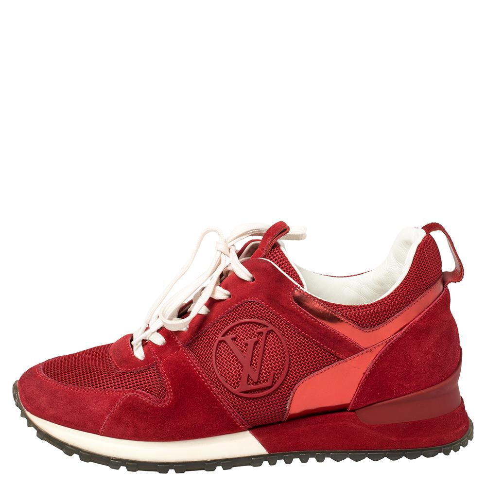 Sporty and stylish, this pair of Louis Vuitton Run Away sneakers has everything that makes it a must-have in your LV collectible. Featuring a vibrant red suede and fabric body, these lace-up shoes come with a tough rubber outsole. The round toes and