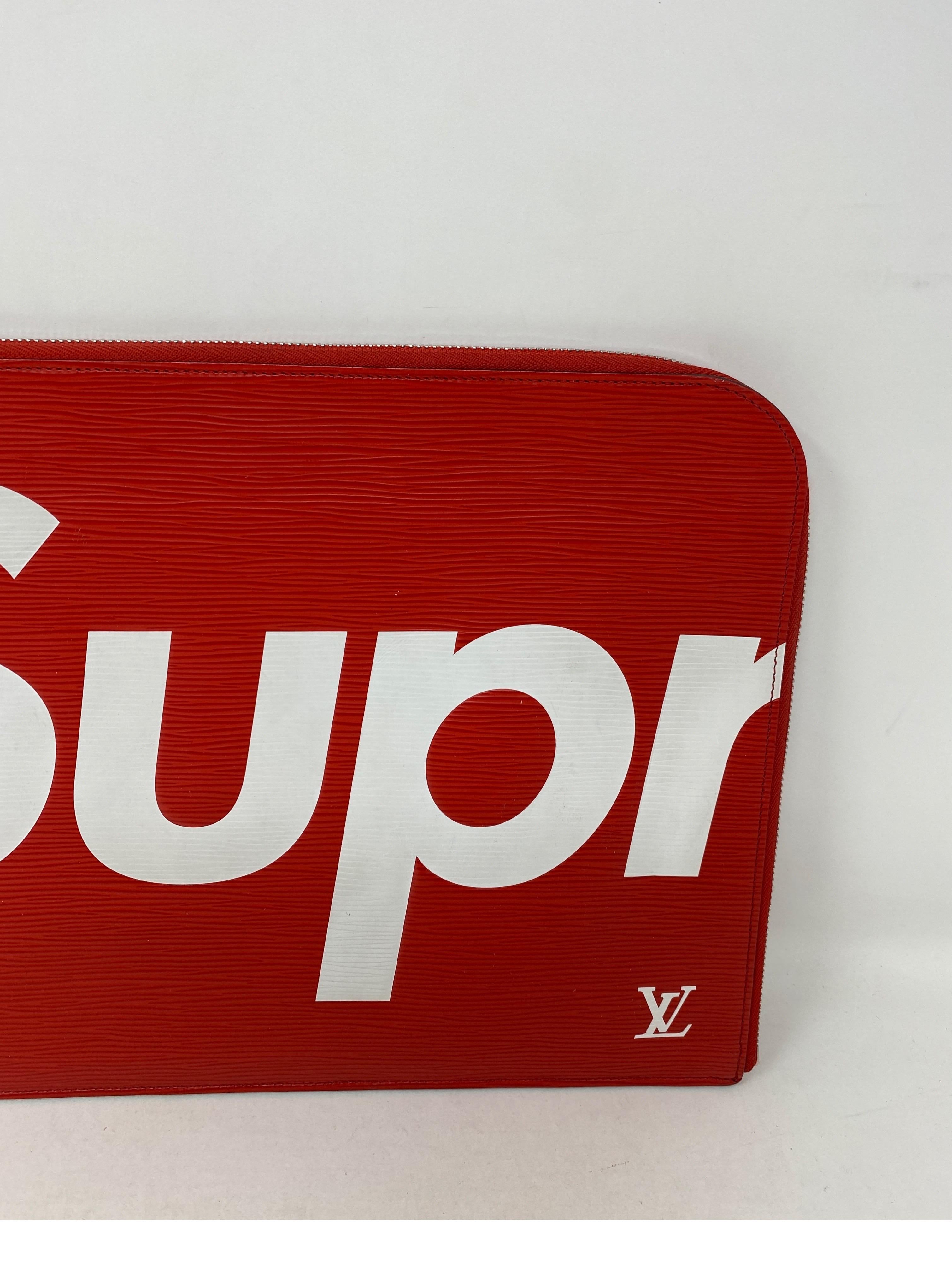 Louis Vuitton Red Supreme Clutch. Portfolio or laptop holder. Can be worn as a clutch or accessory. Red epi leather by LV and Supreme Collaboration. Rare and limited collection. Good condition. Guaranteed authentic. 