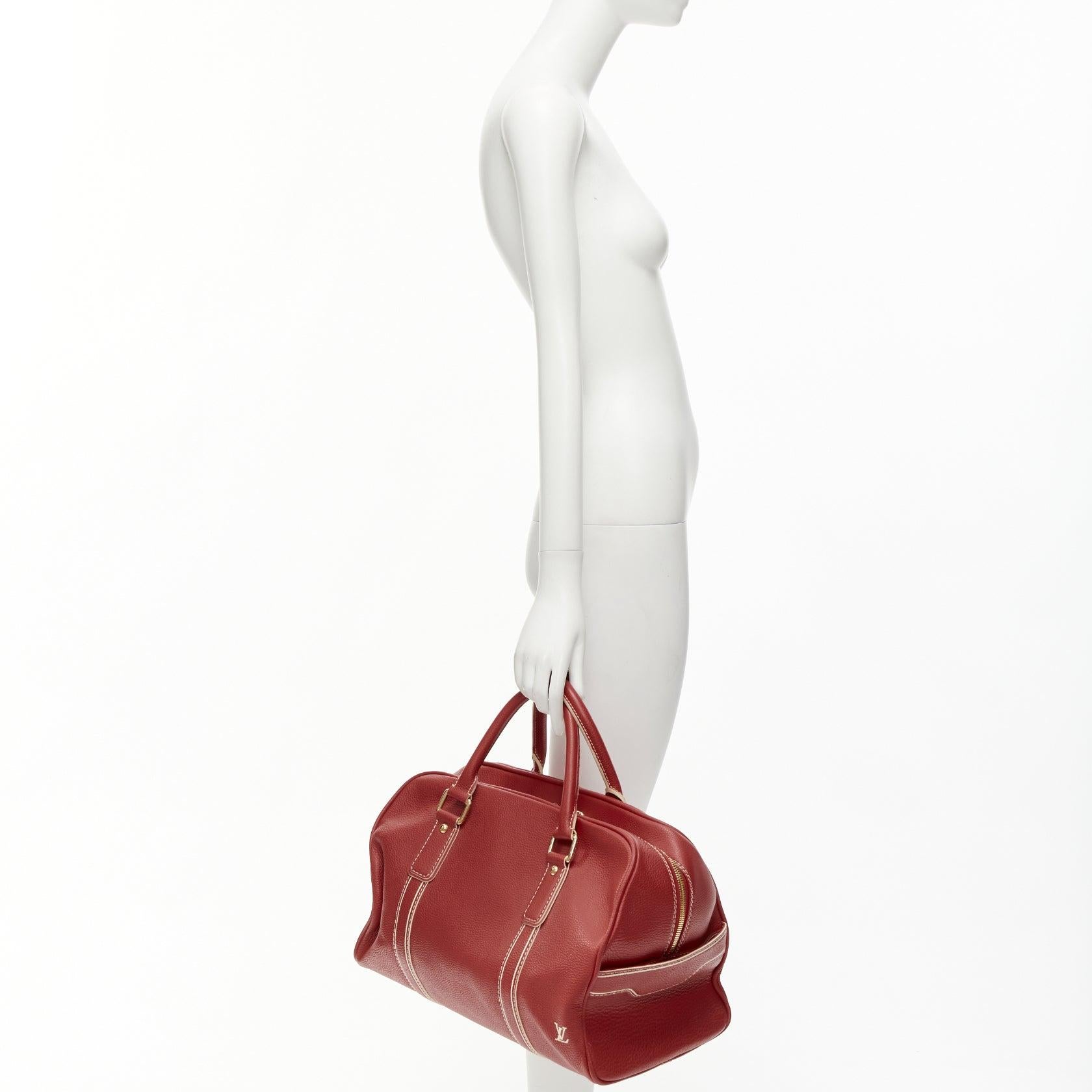 LOUIS VUITTON Red Tobaco Leather Carryall Boston Duffle top handle travel bag
Reference: NKLL/A00249
Brand: Louis Vuitton
Model: Carryall
Material: Leather
Color: Red, Gold
Pattern: Solid
Closure: Zip
Lining: Grey Fabric
Extra Details: LV white logo