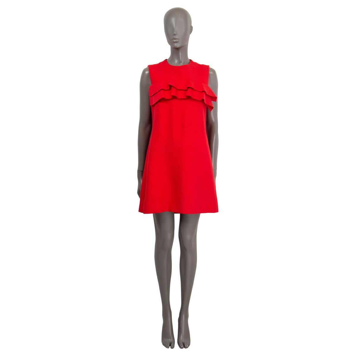 100% authentic Louis Vuitton sleeveless a-line mini dress in red (viscose 76%) and silk (24%) with ruffle detail around the chest. Opens with a black zipper on the back and is lined in silk (100%). Has been worn and is in excellent condition.