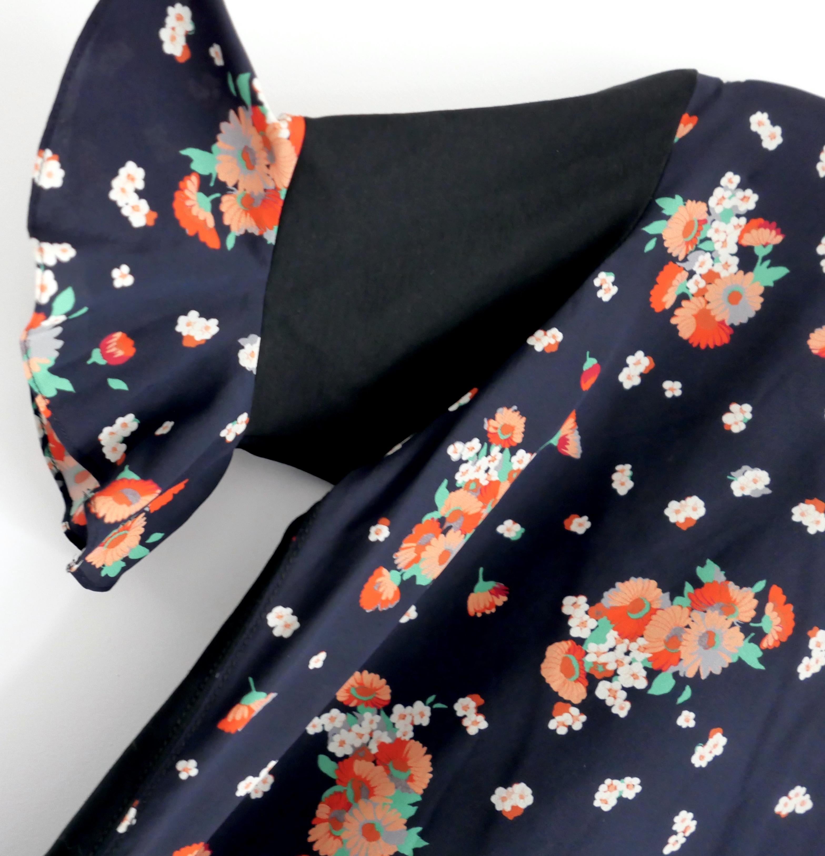 Super cool casual cute Louis Vuitton floral top from the Resort 2017 collection - worn once and has been newly dry cleaned (this has faded comp/wash label). Has a floral silk front and cotton jersey back, crew neck, frilled short sleeves and little
