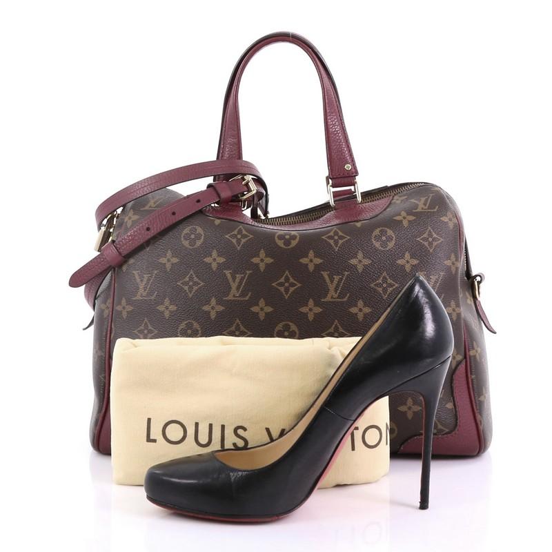 This Louis Vuitton Retiro NM Handbag Monogram Canvas, crafted in brown monogram coated canvas, features dual flat leather handles, leather trim, and gold-tone hardware. Its zip closure opens to a purple microfiber interior with slip pockets.