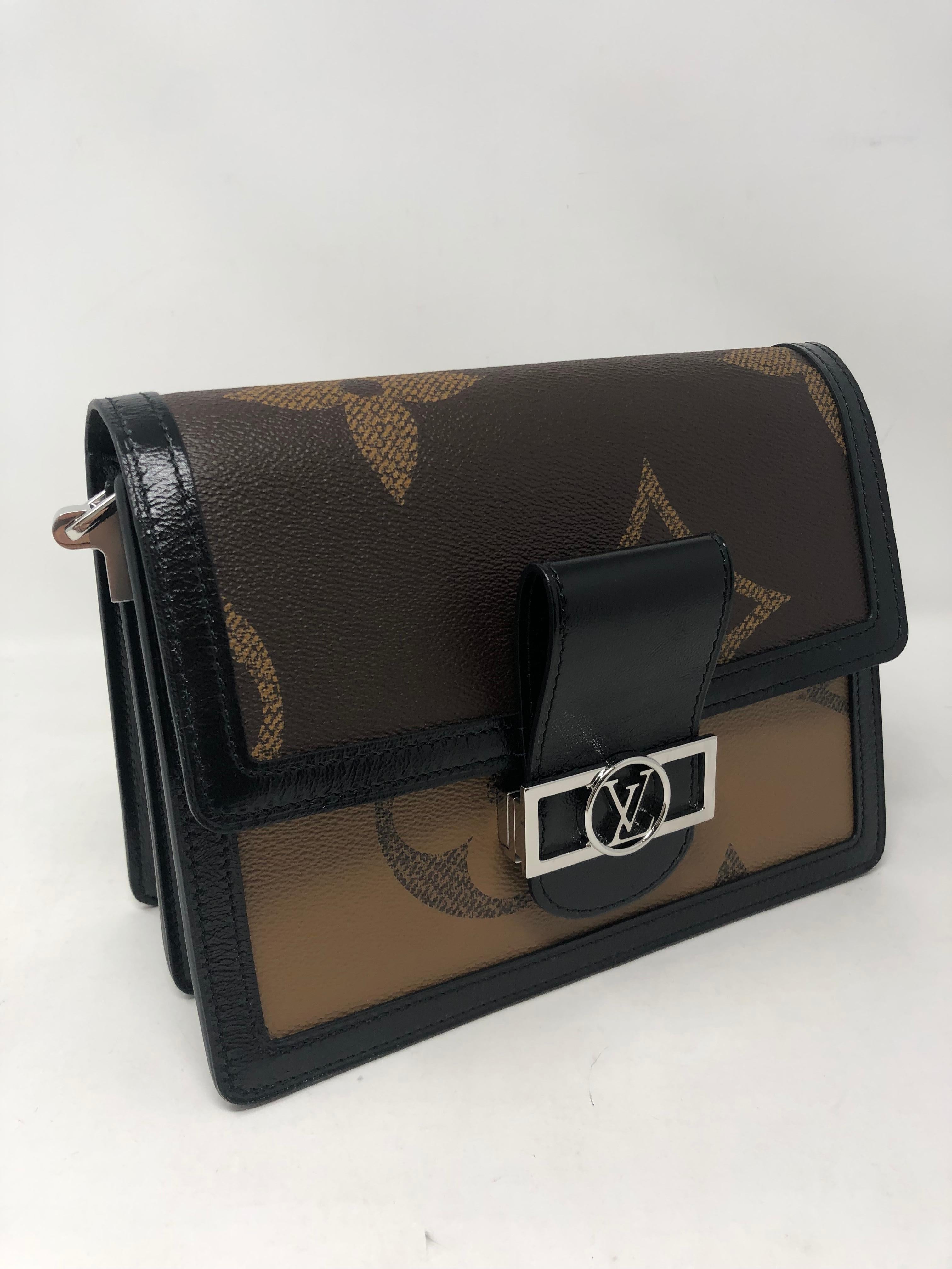 Louis Vuitton Reverse Monogram Giant Dauphine MM Bag. Brand new. Has 2 optional straps, one in black leather and silver chain strap. Gorgeous bag includes LV dust cover and box. Guaranteed authentic. 