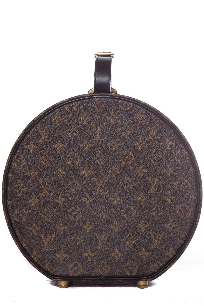 Louis Vuitton Reverse Monogram Boite Chapeau 30 with gold-tone hardware, black leather top handle, charcoal ultra suede interior, single interior pocket and push lock closure.