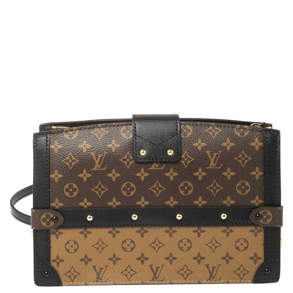 Released as part of Louis Vuitton's Fall 2018 collection by Nicholas Ghesquiere, the Trunk Clutch is like a beautiful reiteration of the Petite Malle and inspired by the iconic Louis Vuitton trunks. Crafted from Monogram reverse canvas, the clutch