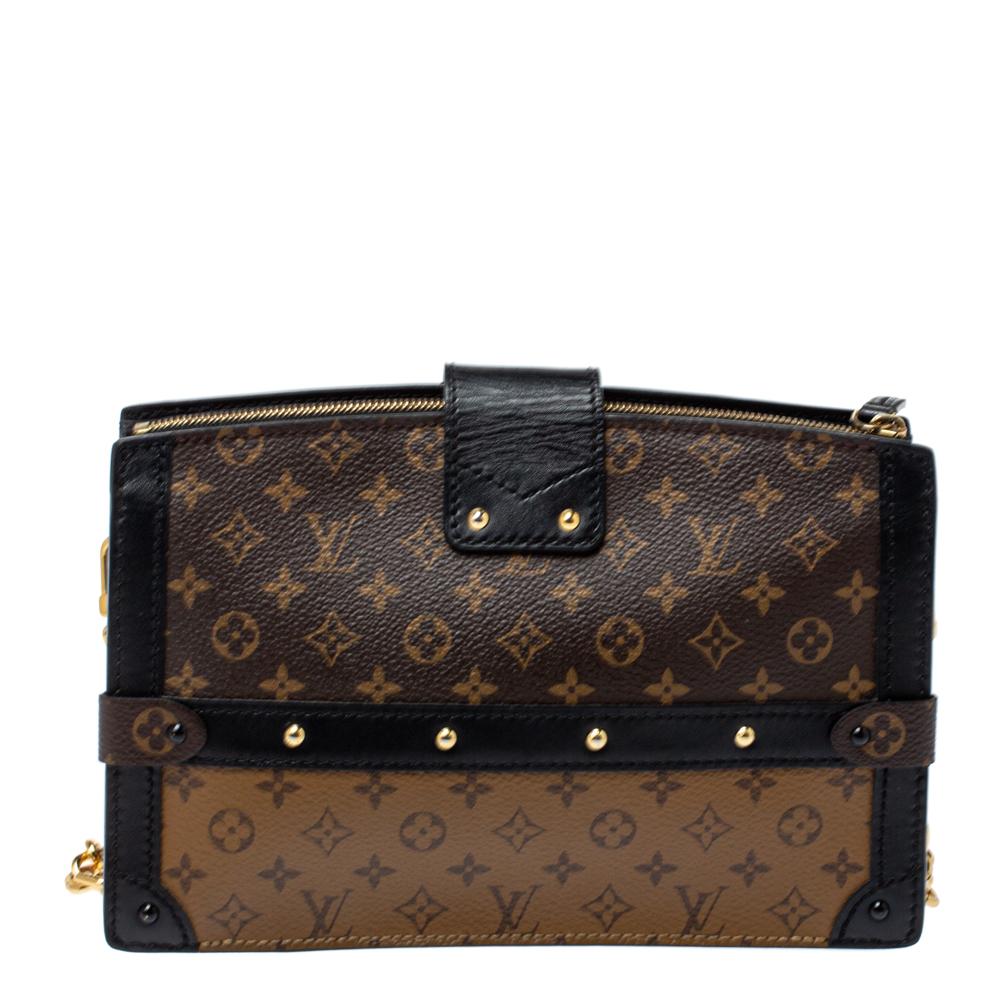 Delivered as part of Louis Vuitton's Fall 2018 collection by Nicholas Ghesquiere, the Trunk Clutch is like a stunning reiteration of the Petite Malle and inspired by the iconic Louis Vuitton trunks. Crafted from Monogram reverse canvas, the clutch