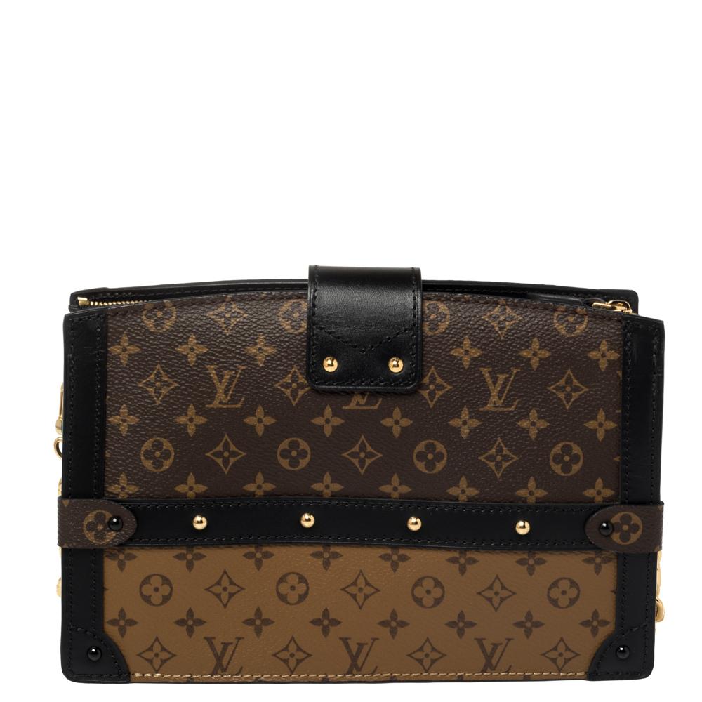 Released as part of Louis Vuitton's Fall 2018 collection by Nicholas Ghesquiere, the Trunk Clutch is like a beautiful reiteration of the Petite Malle and inspired by the iconic Louis Vuitton trunks. Crafted from Monogram reverse canvas, the clutch