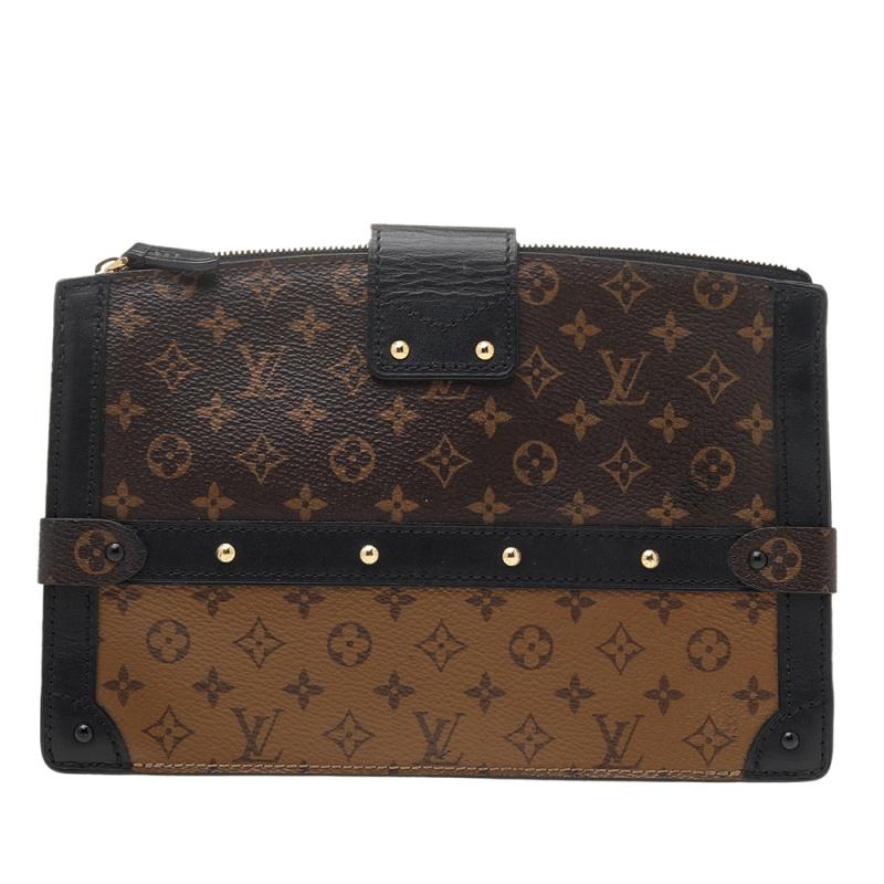 Delivered as part of Louis Vuitton's Fall 2018 collection by Nicholas Ghesquiere, the Trunk Clutch is like a stunning reiteration of the Petite Malle and inspired by the iconic Louis Vuitton trunks. Crafted from Monogram reverse canvas, the clutch