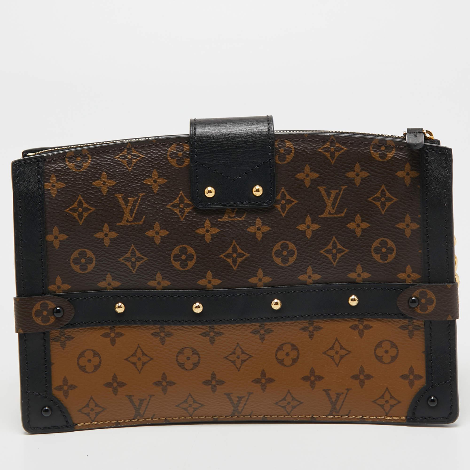 Delivered as part of Louis Vuitton's Fall 2018 collection by Nicholas Ghesquiere, the Trunk Clutch is like a stunning reiteration of the Petite Malle and is inspired by the iconic Louis Vuitton trunks. Crafted from Monogram reverse canvas, the