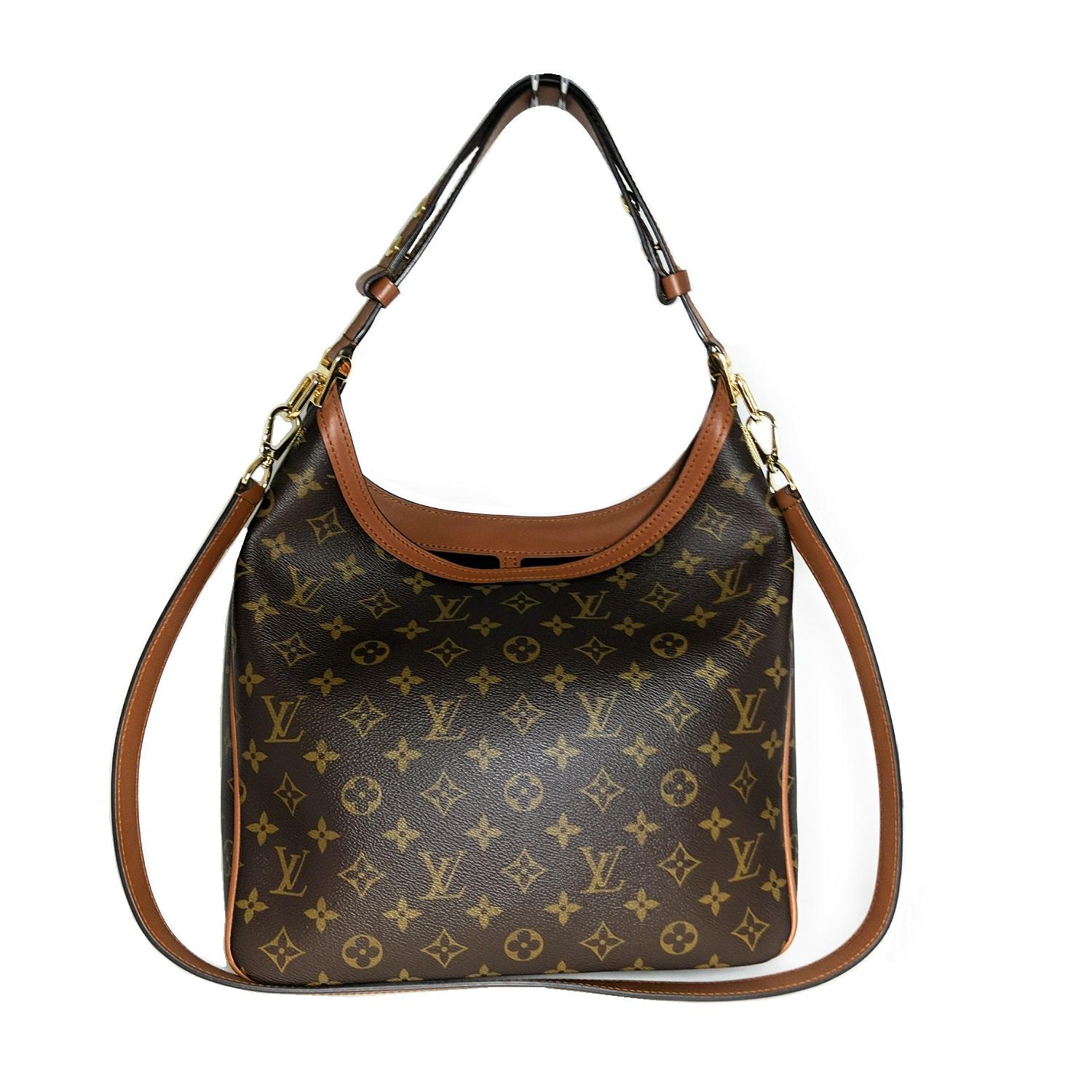 This stylish shoulder bag is crafted of Louis Vuitton monogram on toile canvas. The bag features a toffee-colored leather looping shoulder strap, an optional leather trim shoulder strap, and a front pocket with a decorative brass Louis Vuitton logo.