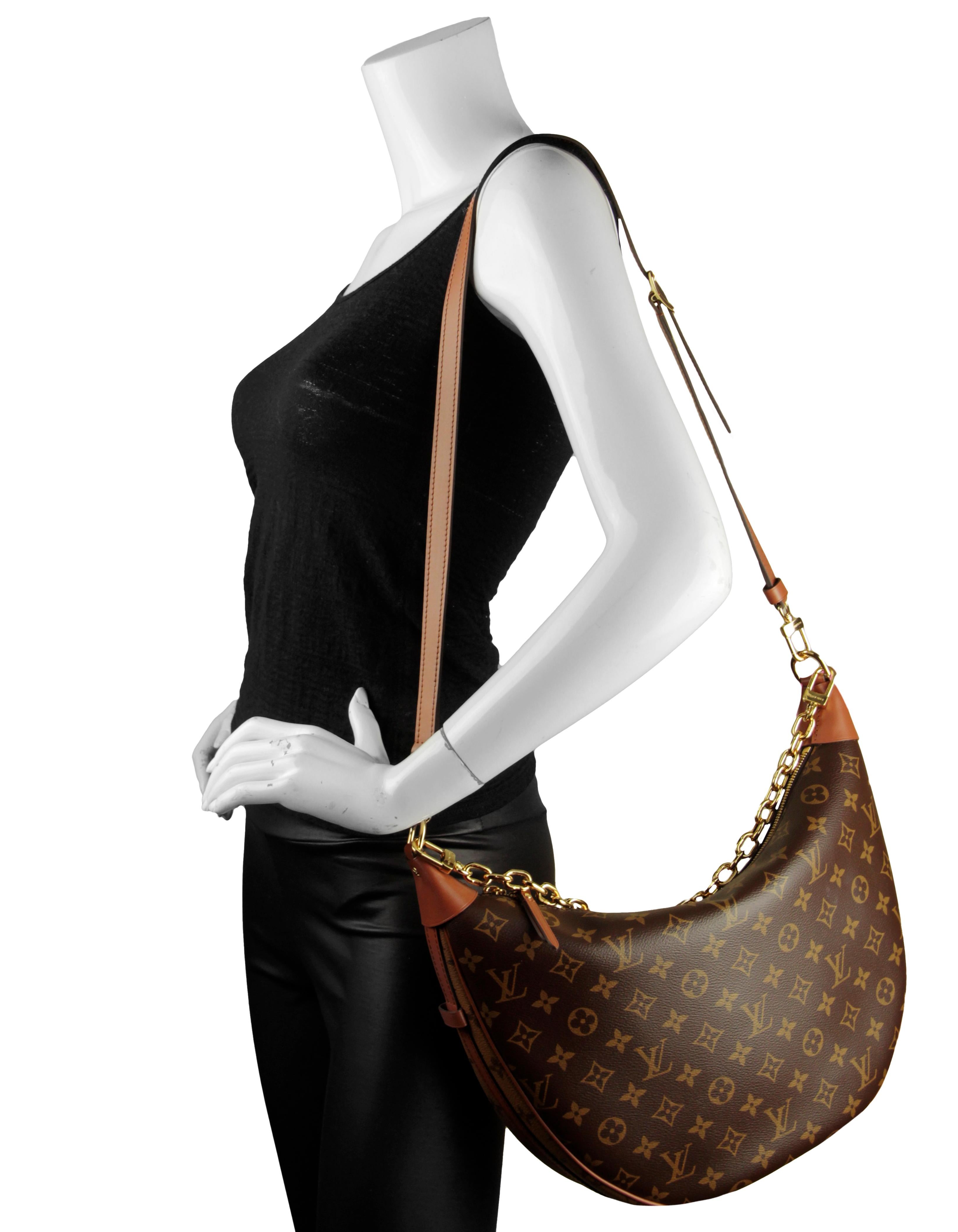 Louis Vuitton Reverse Monogram Loop Hobo Bag. Features removable chain strap and crossbody/shoulder strap.

Made In: France
Color: Brown and tan
Hardware: Goldtone hardware
Materials: Coated canvas with cowhide leather trim
Lining: Brown
