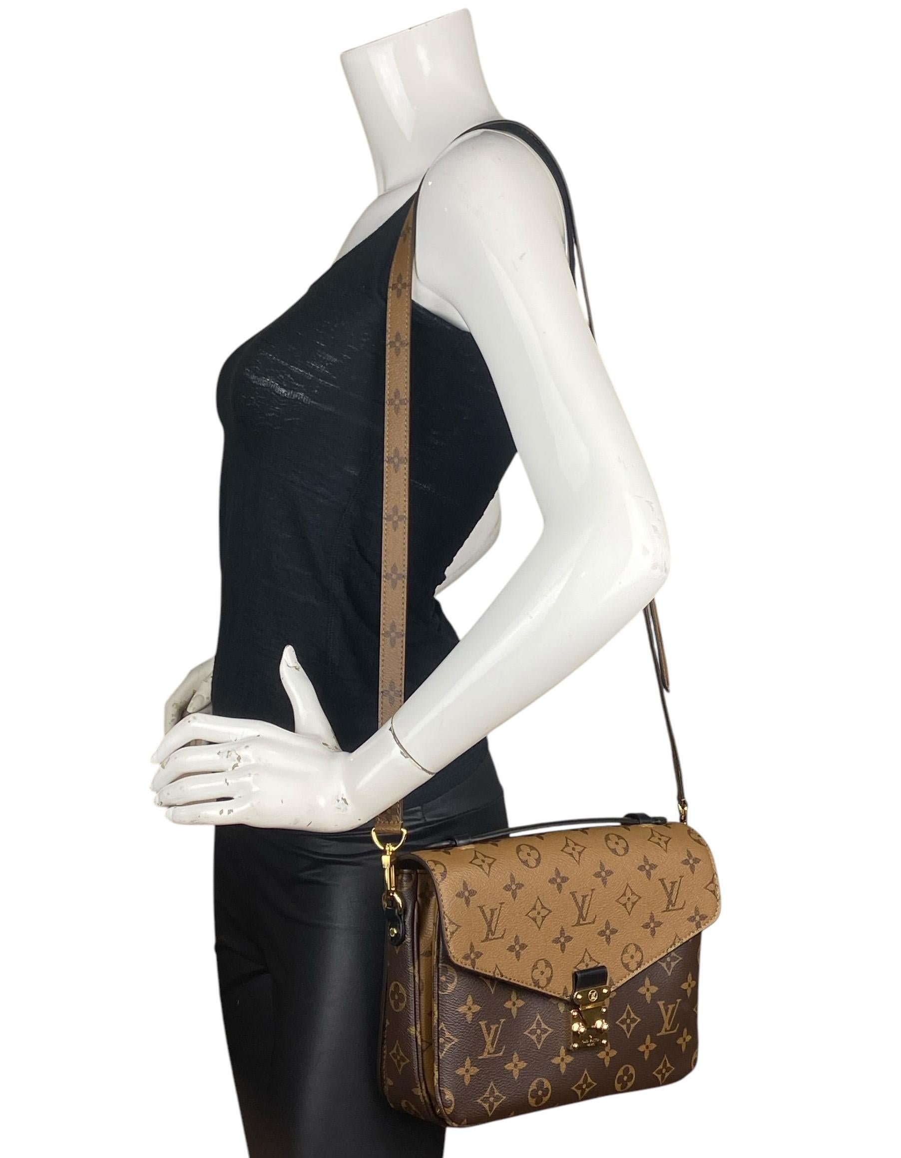 Louis Vuitton Reverse Monogram Pochette Metis Messenger Bag

Made in: Italy
Year of Production: 2018
Color: Brown, tan, black
Hardware: Goldtone
Materials: Coated canvas
Lining: Black fine textile
Closure/Opening: Flap top with s-lock
Exterior
