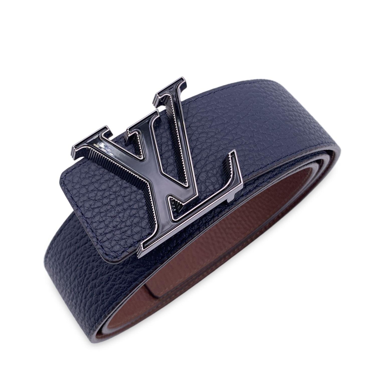 This beautiful belt will come with a Certificate of Authenticity provided by Entrupy. The certificate will be provided at no further cost. LOUIS VUITTON reversible 'LV tilt' belt. Made of fine blue and brown Taurillon leather. The belt features a