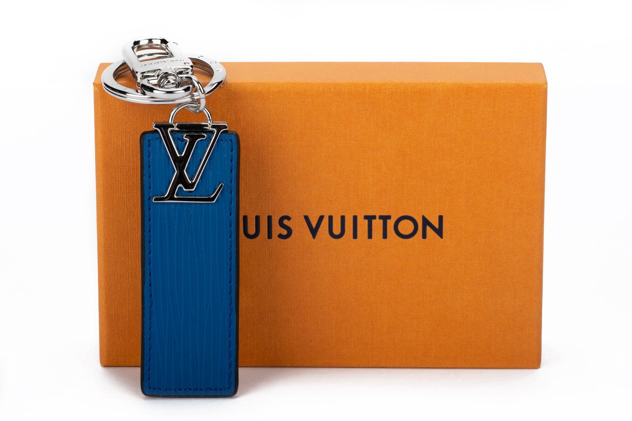 Louis Vuitton reversible blue /black keychain or bag charm with silver tone hardware. Excellent condition with original box and dustcover.