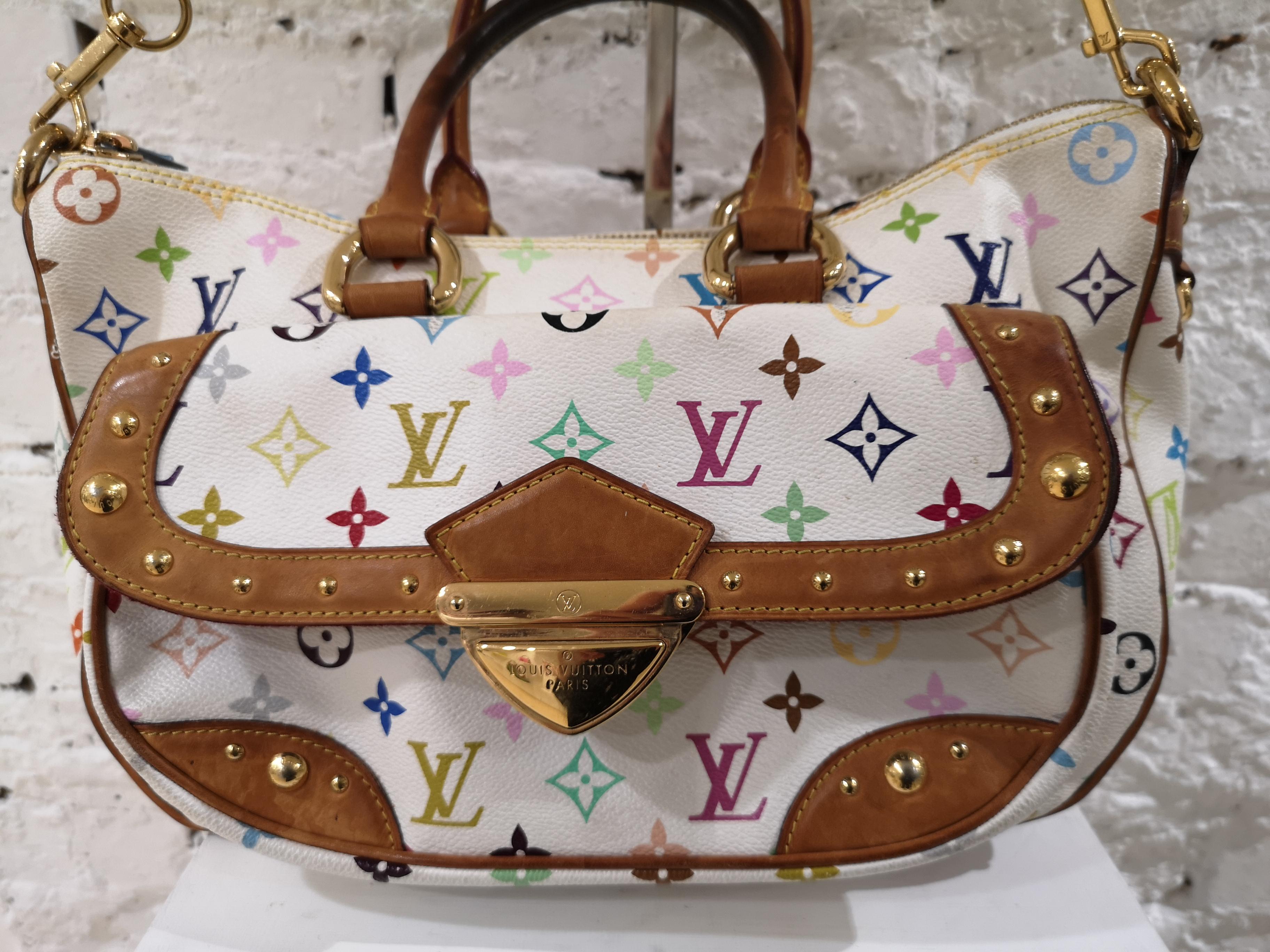 Louis Vuitton Rita White LV multi shoulder bag
Rita White Multicolor Shoulder Bag. The Louis Vuitton Rita bag is truly a rare and beautiful piece with a feminine touch. It is made with the classic white multicolored monogram canvas, natural vachetta