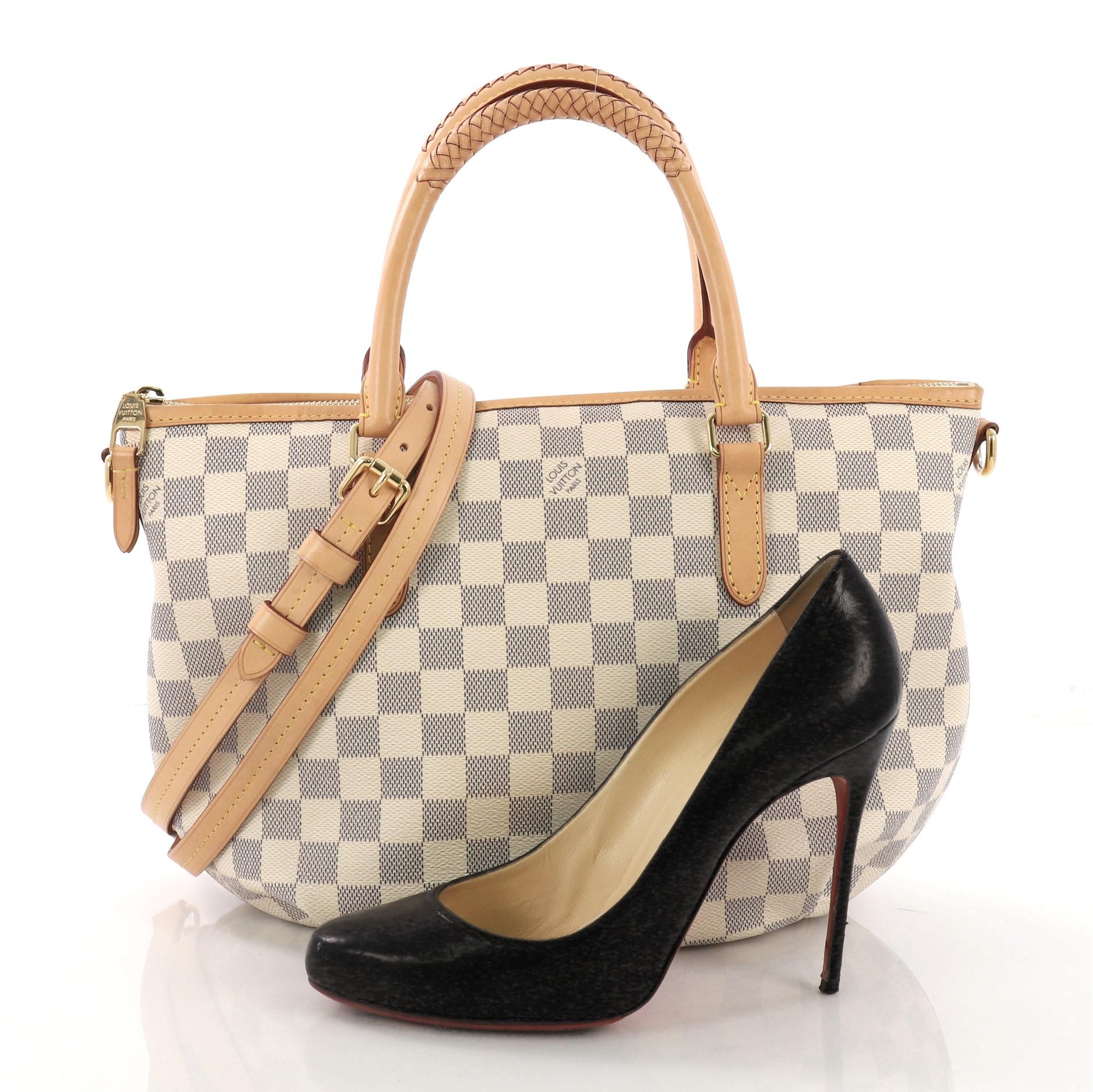 This Louis Vuitton Riviera Handbag Damier PM, crafted from damier azur coated canvas, features dual braided handles, vachetta leather trim, and gold-tone hardware. Its zip closure opens to a beige fabric interior with slip pockets. Authenticity code