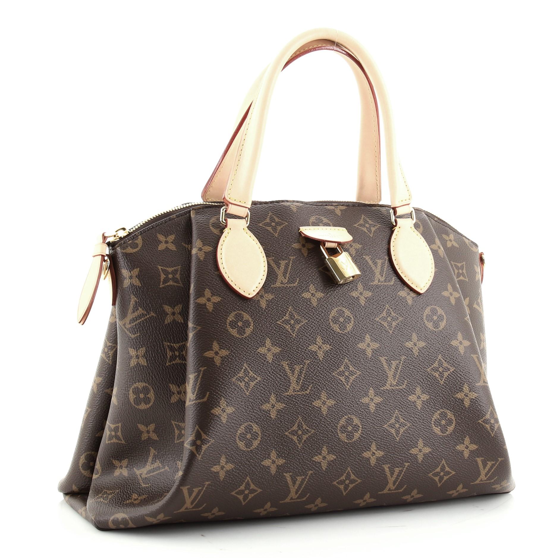 Condition: Damaged. Heavy odor in interior. Slight darkening, wear and watermarks on leather trims, handle and strap, scratches on hardware.
Accessories: Lock, With Strap
Measurements: Handle Drop 4.5