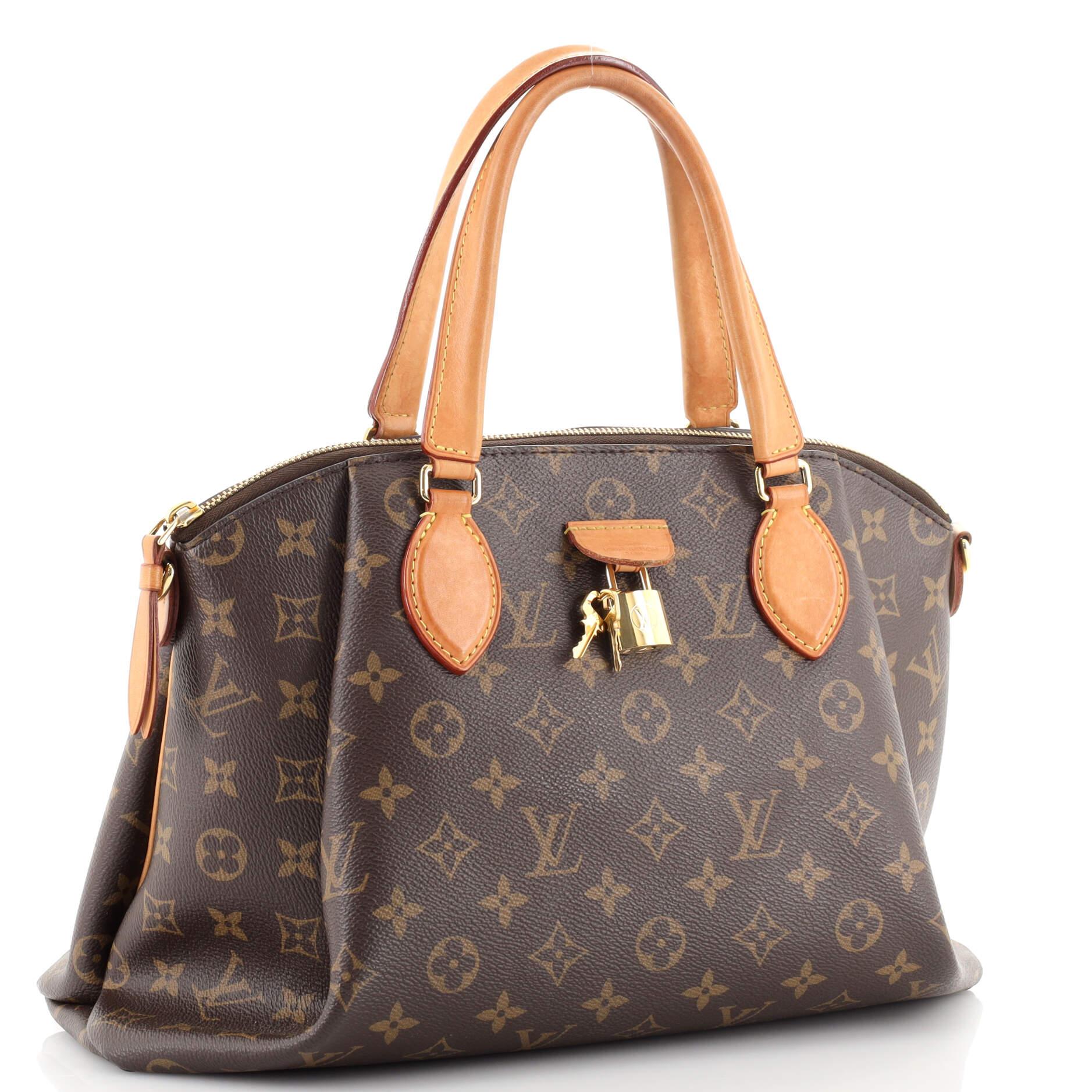 Condition: Fair. Odor in interior. Loss of shape on exterior, heavy darkening, wear, scuffs and watermarks on leather trims, handles and strap. Moderate stains and wear in interior, scratches, tarnish and discoloration on hardware.
Accessories: