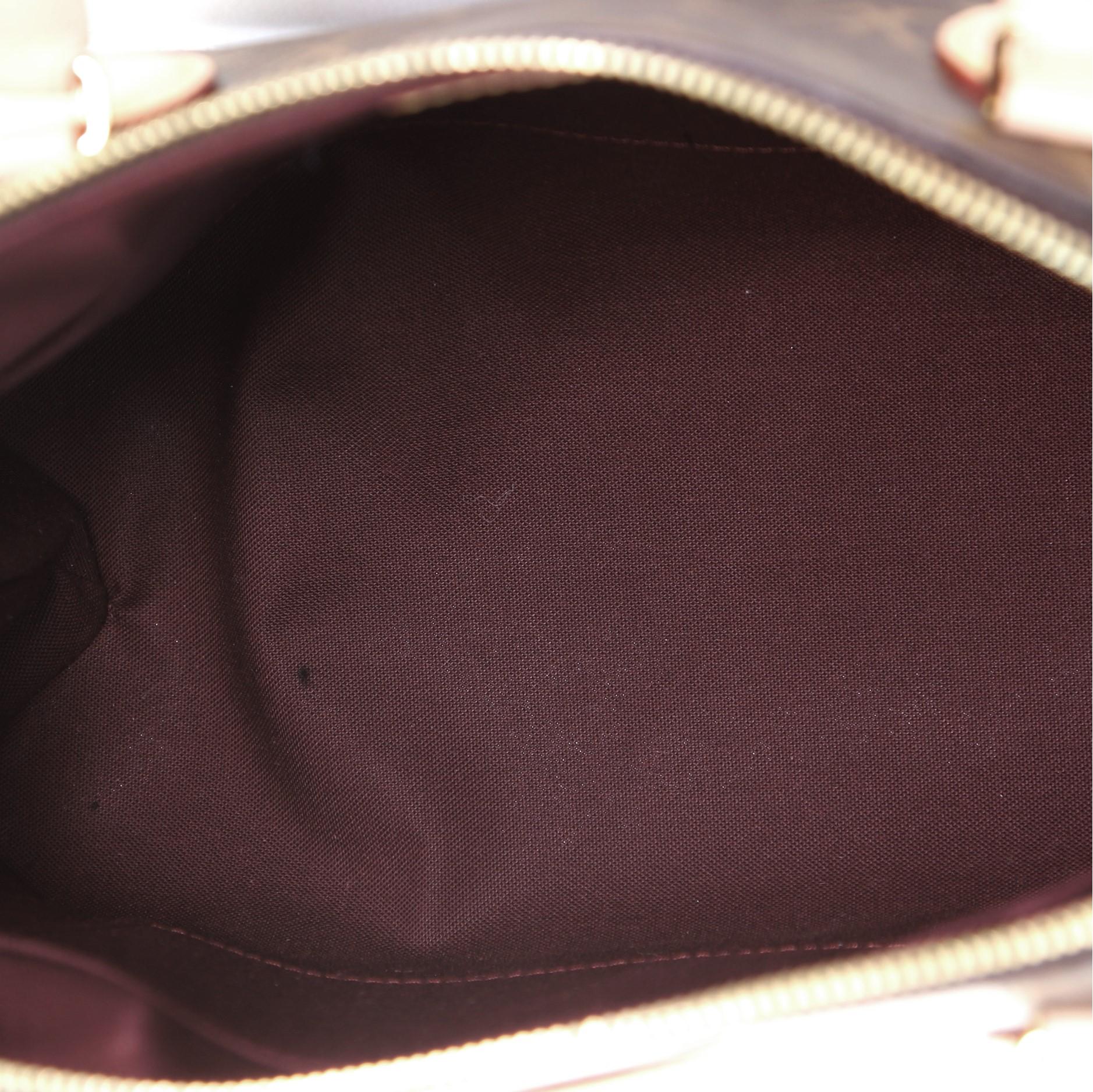 Louis Vuitton Rivoli Handbag Monogram Canvas MM In Good Condition In NY, NY