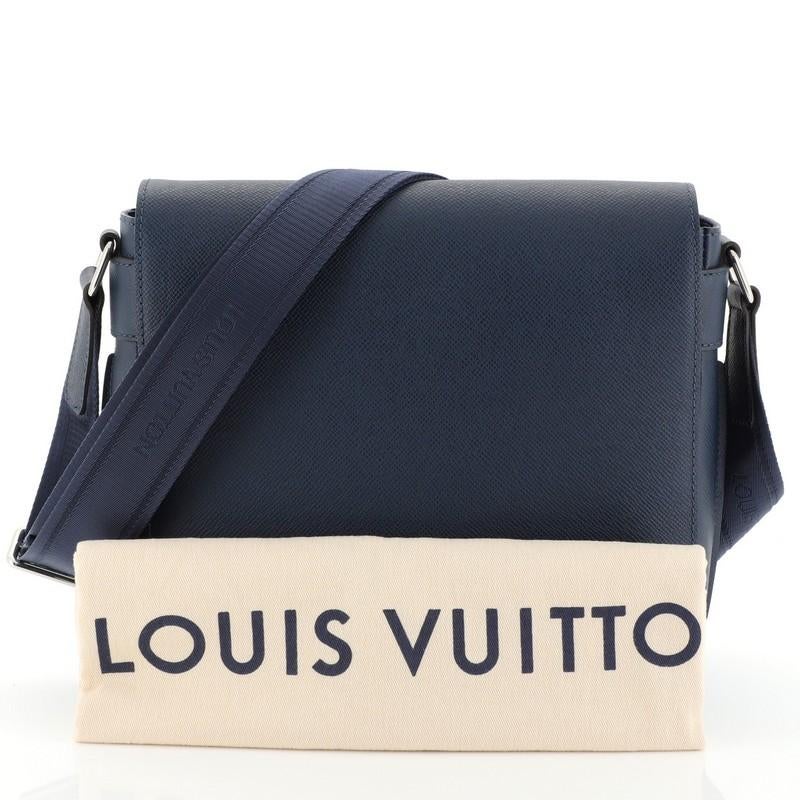 This Louis Vuitton Roman NM Handbag Taiga Leather PM, crafted in blue leather, features an adjustable shoulder strap, frontal strap and silver-tone hardware. Its flap opens to a blue fabric interior with slip pocket. Authenticity code reads: PL4165.