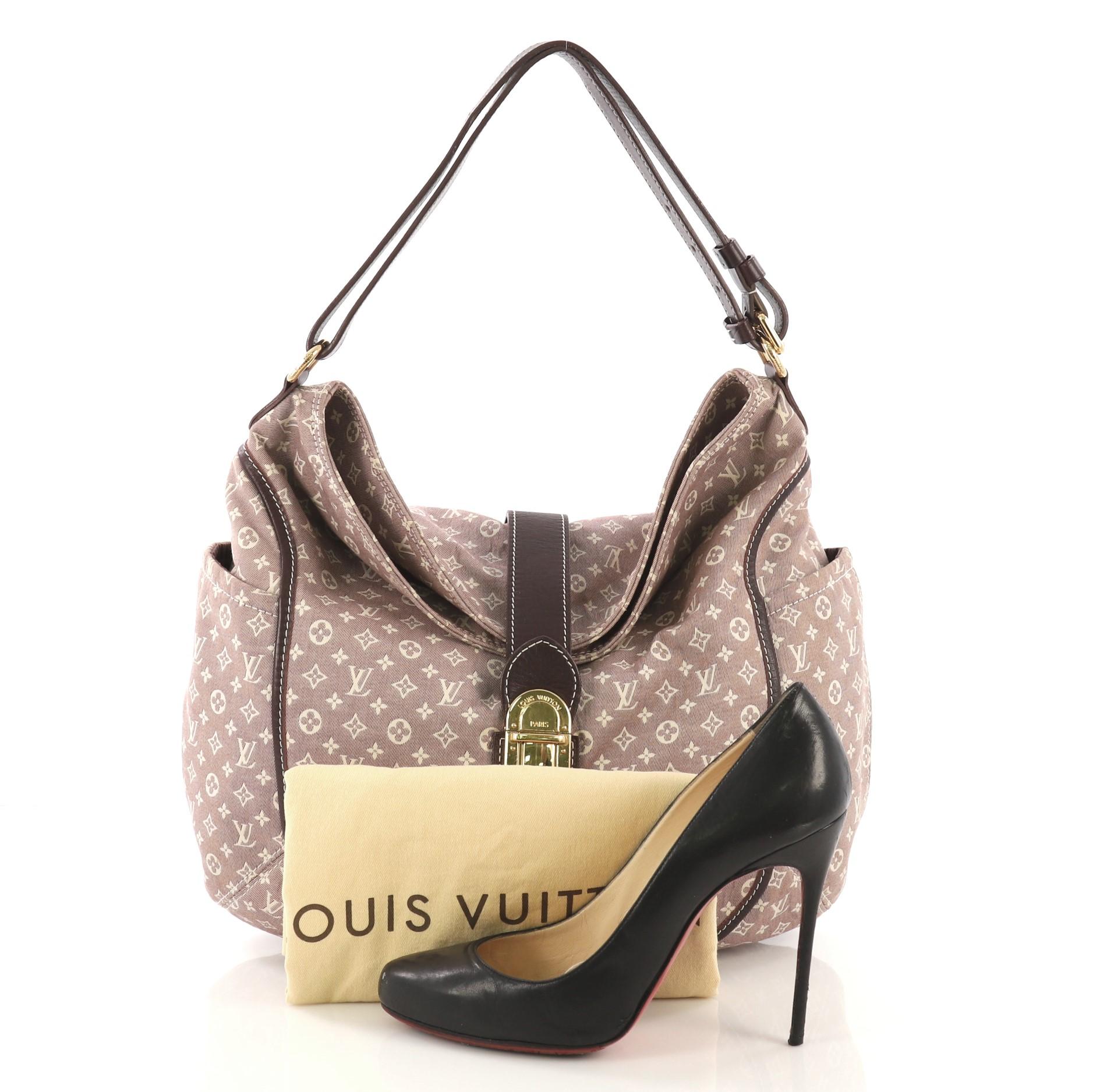 This Louis Vuitton Romance Handbag Monogram Idylle, crafted with light purple monogram idylle canvas, features side slip pockets, adjustable shoulder strap, and gold-tone hardware. Its push-lock closure opens to a purple fabric interior with slip