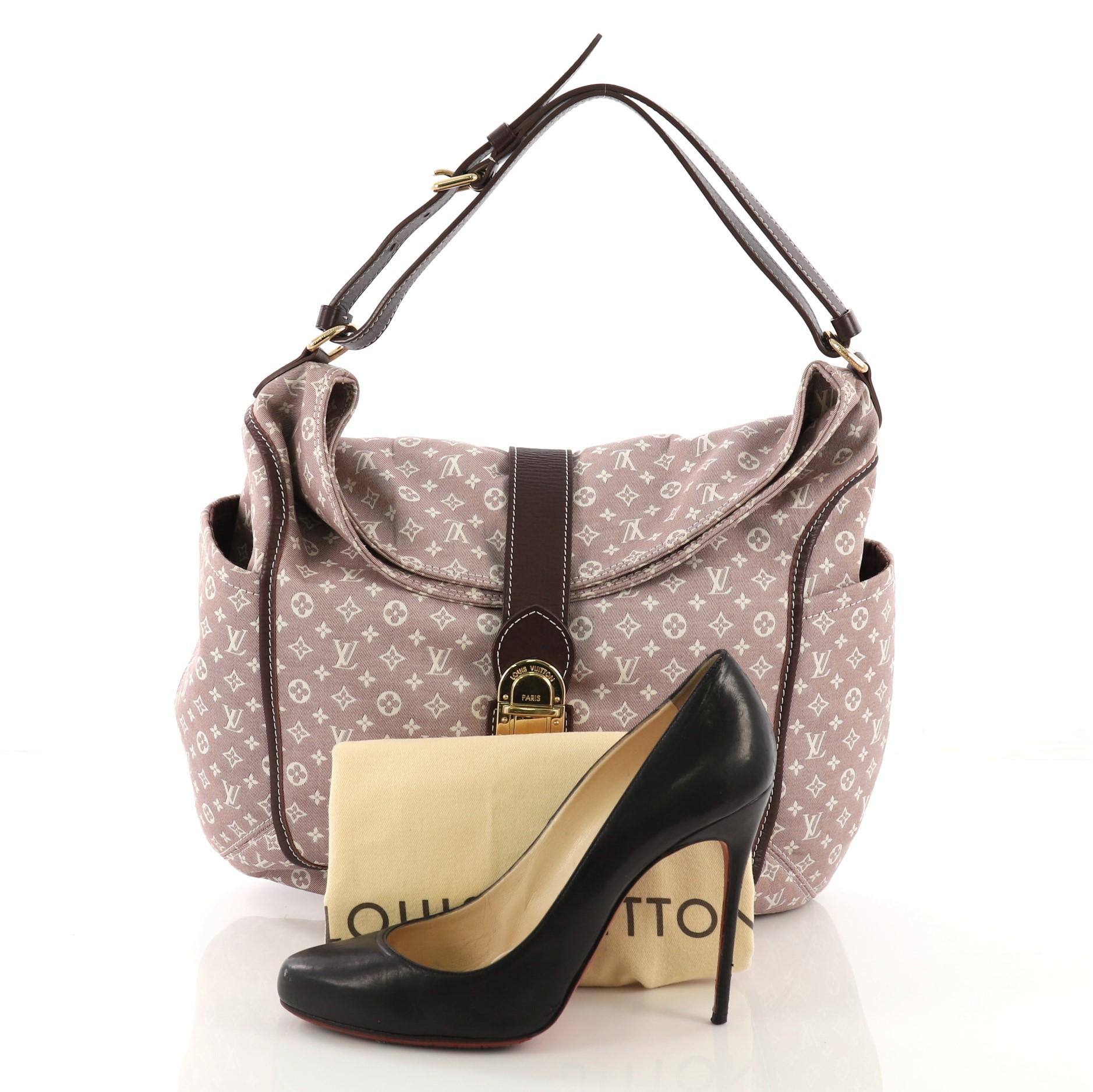 This Louis Vuitton Romance Handbag Monogram Idylle, crafted with light purple monogram idylle canvas, features side slip pockets, adjustable shoulder strap, and gold-tone hardware. Its push-lock closure opens to a purple fabric interior with slip