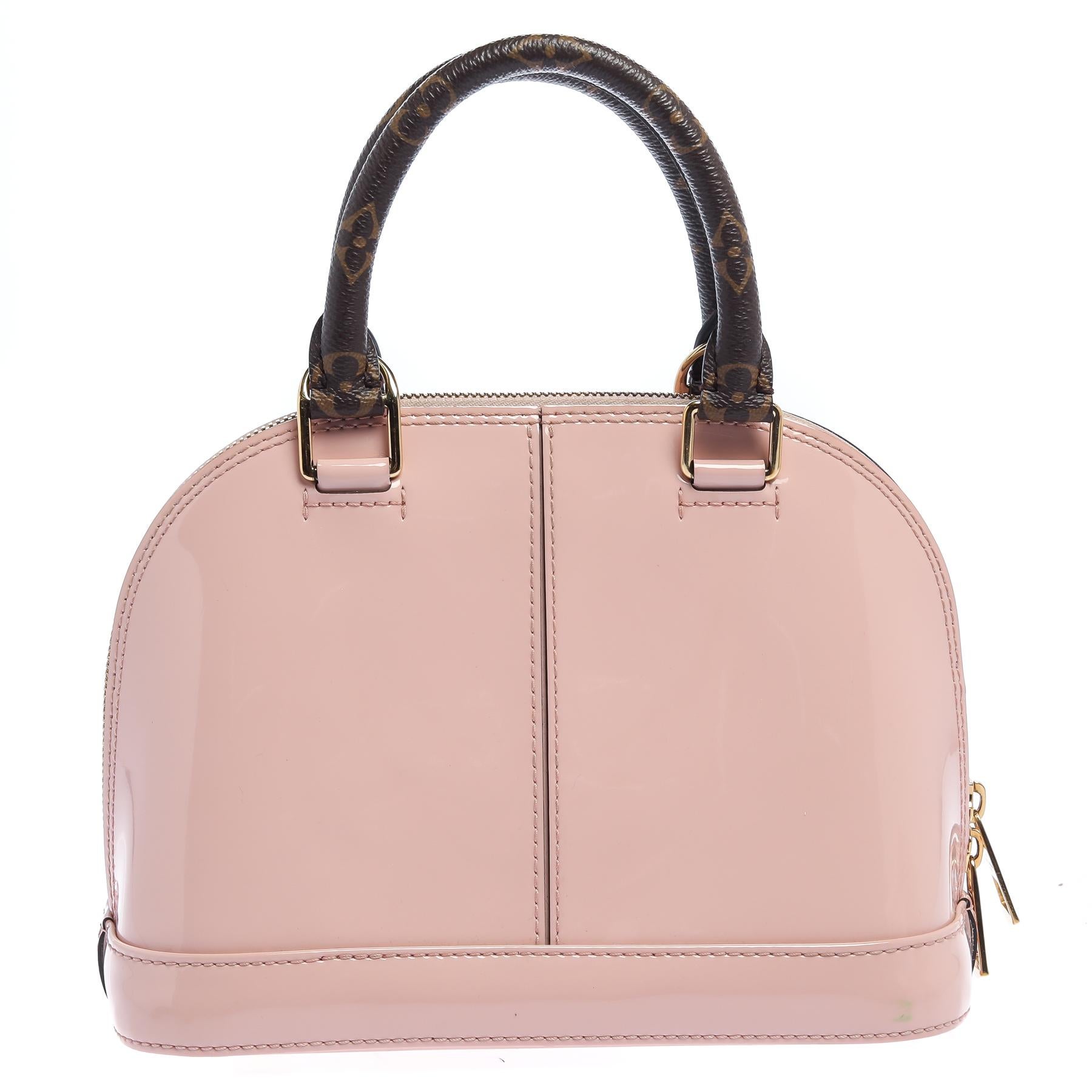 Out of all the irresistible handbags from Louis Vuitton, the Alma is the most structured one. First introduced in 1934 by Gaston-Louis Vuitton, the Alma is a classic that has received love from icons. This piece comes crafted from pink patent