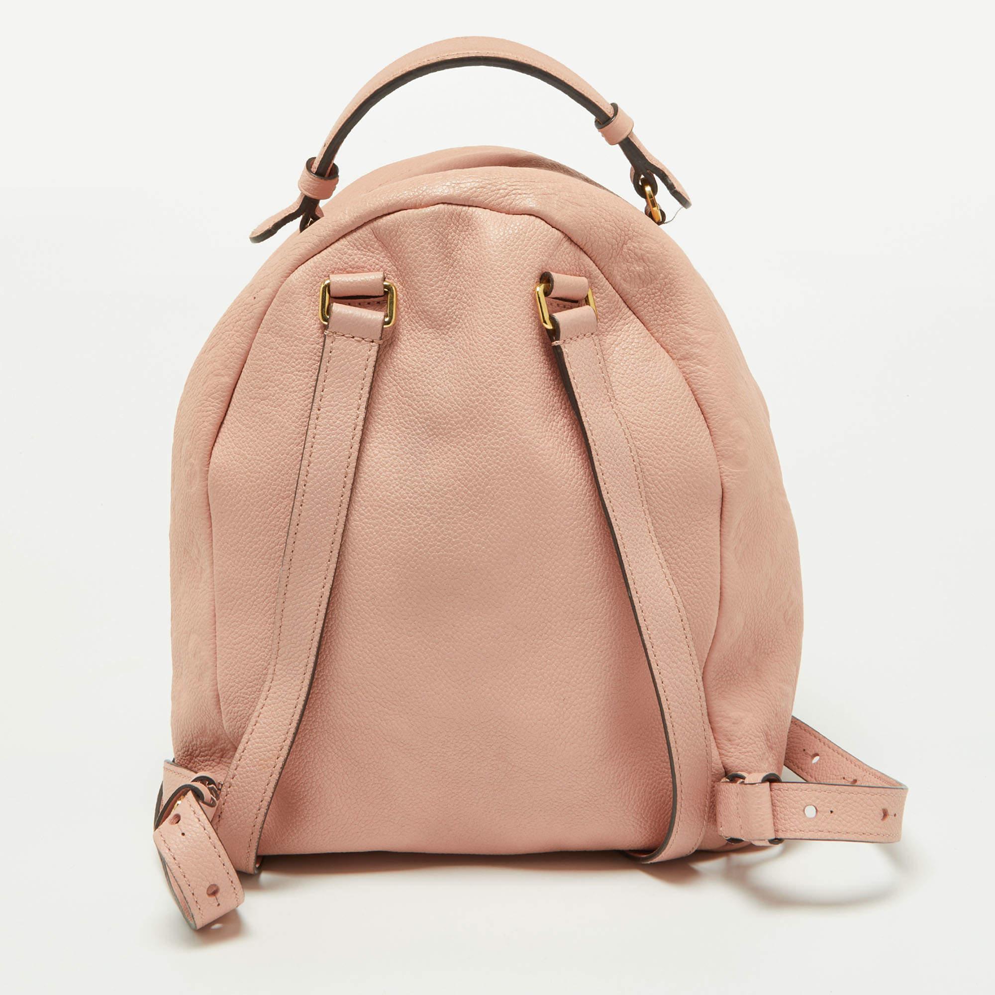 This Sorbonne backpack is an elevating style staple. It has an Empreinte leather exterior with a front zip pocket. The bag has a top handle, two shoulder straps, and a fabric-lined interior. This gorgeous piece will bring you countless days of high
