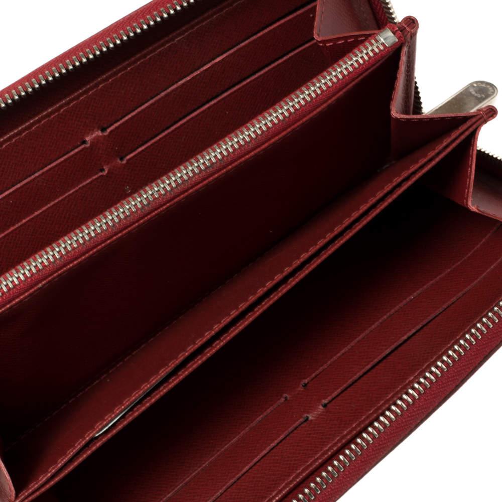 This Louis Vuitton Zippy wallet is conveniently designed for everyday use. Crafted from the signature Epi leather the wallet has a wide zip closure that opens to reveal multiple slots leather lined compartments and a zip pocket for you to neatly
