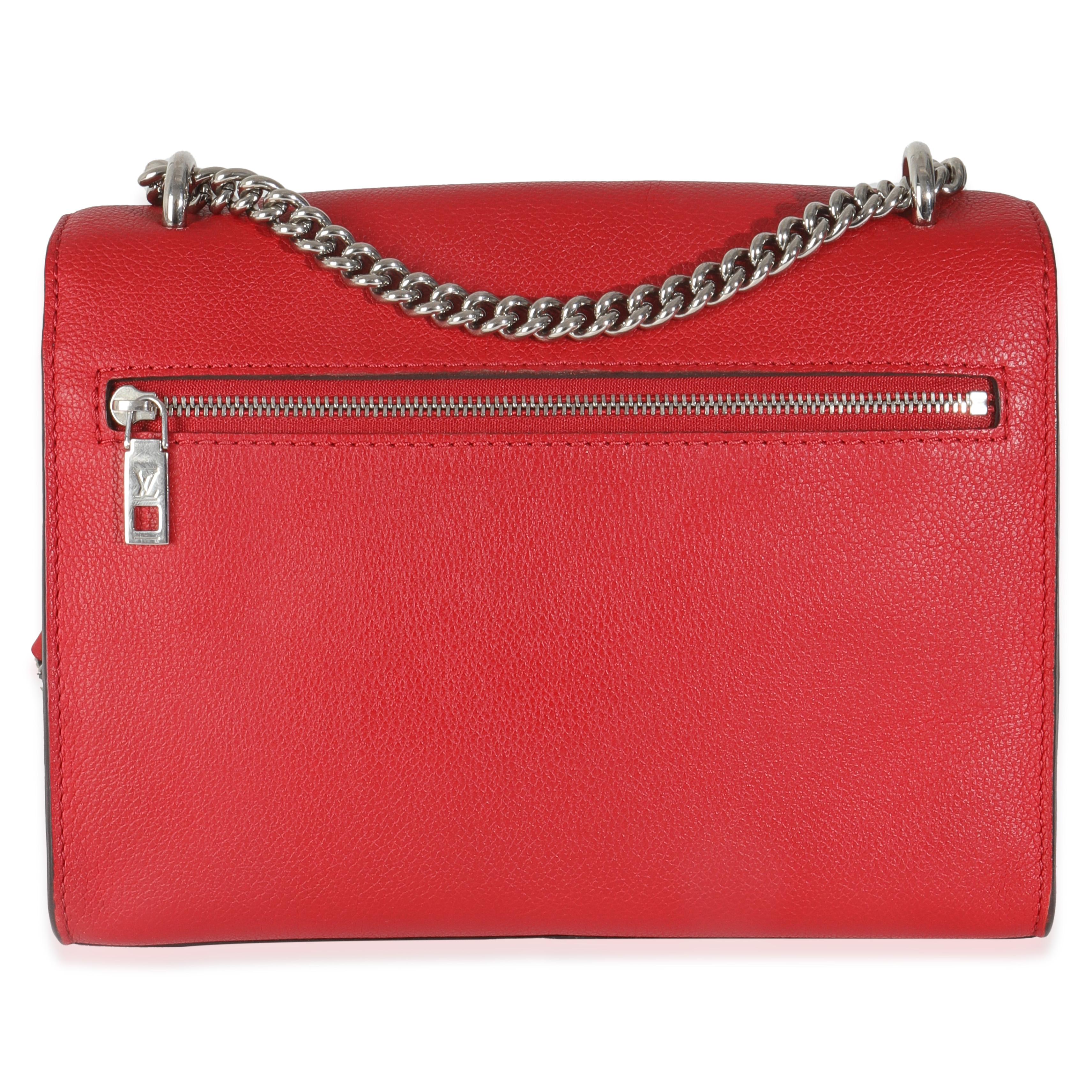 Listing Title: Louis Vuitton Rubis Soft Calfskin Mylockme Chain BB
SKU: 145086
Condition: Pre-owned 
Condition Description: The Lockme designs from Louis Vuitton get their name from the turn-lock closure that features on the LV logo plaque. The