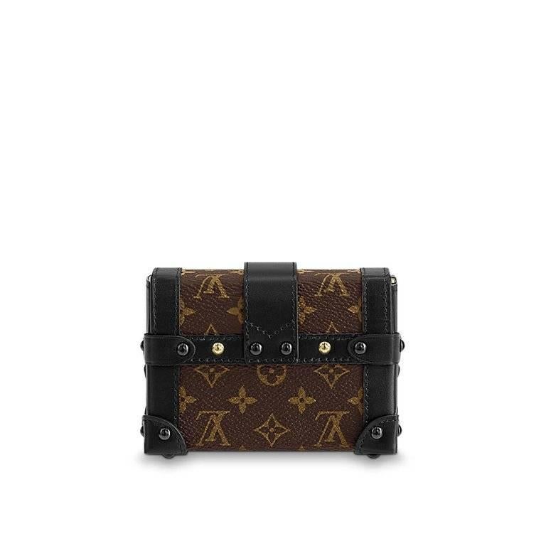 A miniature version of Louis Vuitton's iconic Petite Malle, replicating key details of the historic trunks, the Essential Trunk is the most elegant way to carry a few precious essentials. Its removable chain offers different carry options, while it