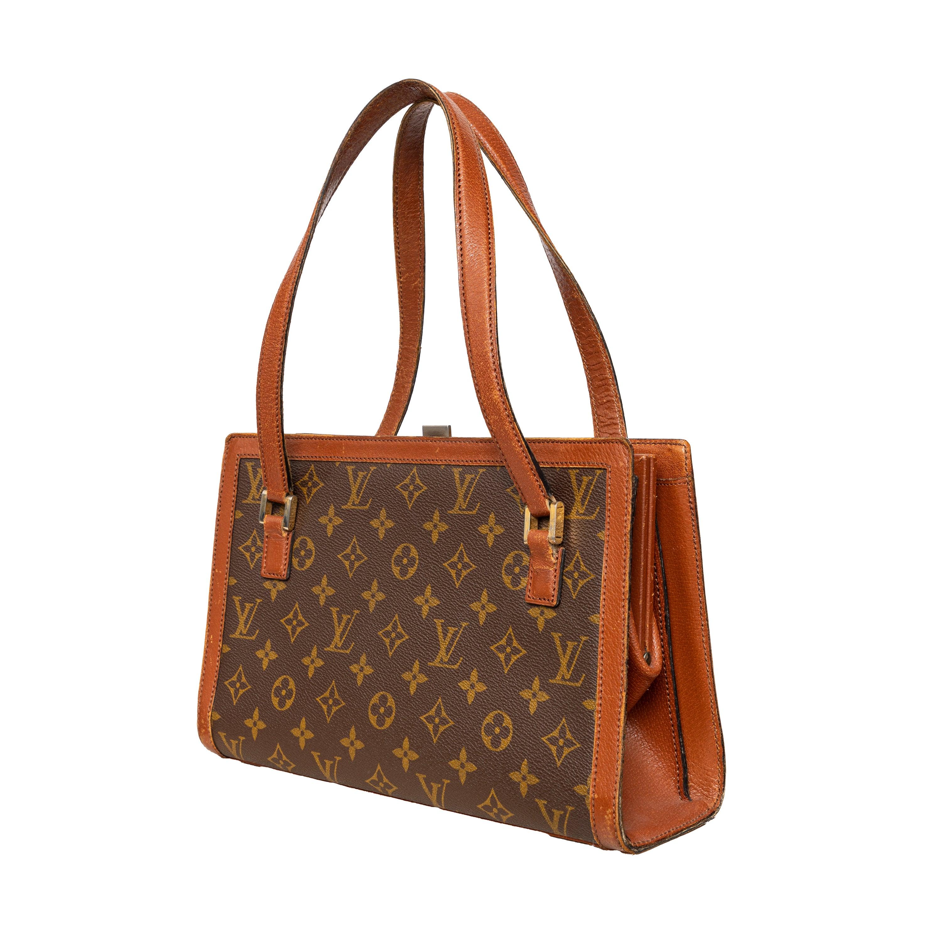 Louis Vuitton Sac Bavolet Bag features brown coated canvas with LV Monogram, brass hardware, dual shoulder straps, leather trim, leather lining, and three interior pockets.
 Remarks: There are scratches and signs of wear. 
 Measurement: