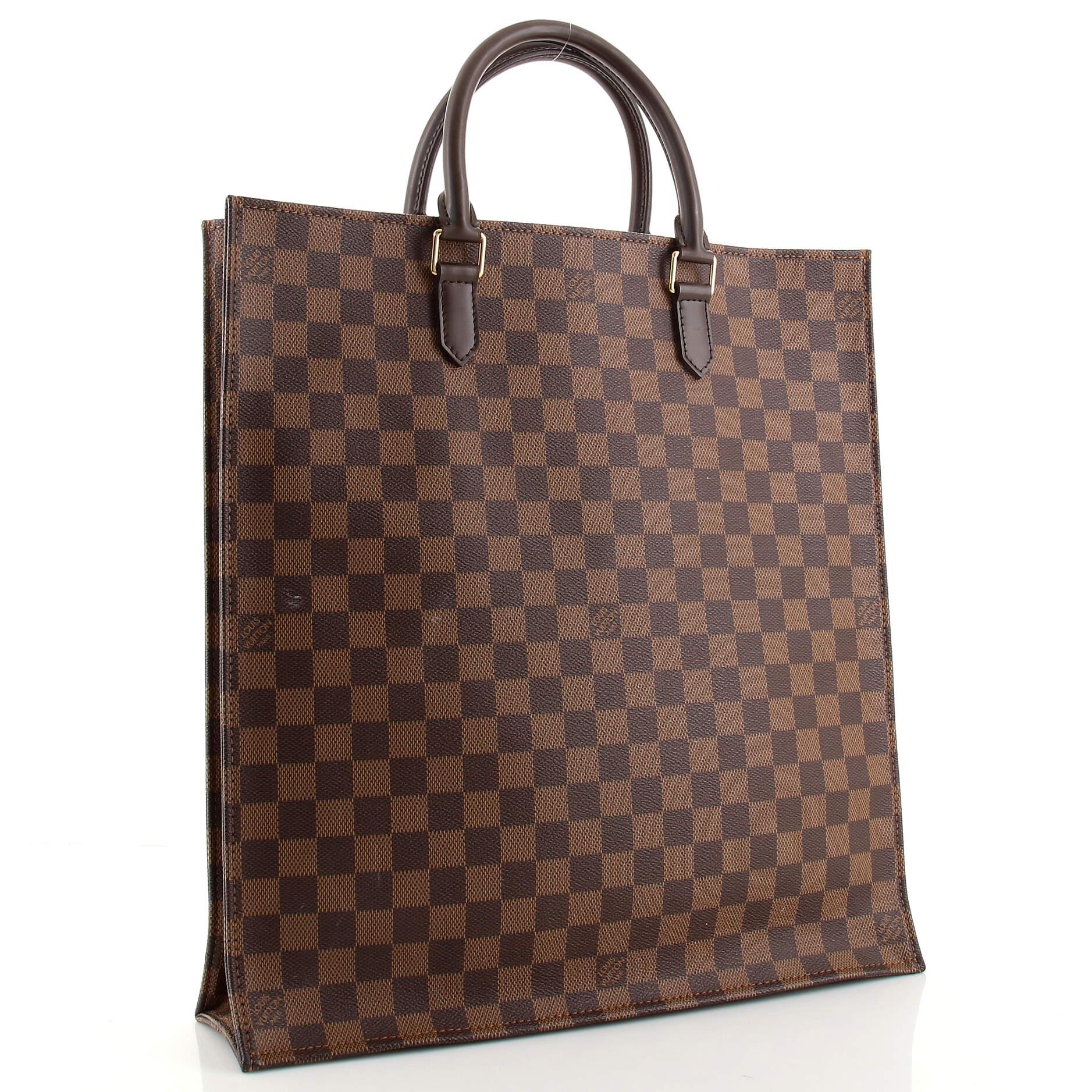 Condition: Outlet. Torn interior loop on opening trim. Loss of shape near base, wear and darkening on base and opening corners. Light wear and scuffs on handles, scratches on hardware.
Accessories: No Accessories
Measurements: Handle Drop 4