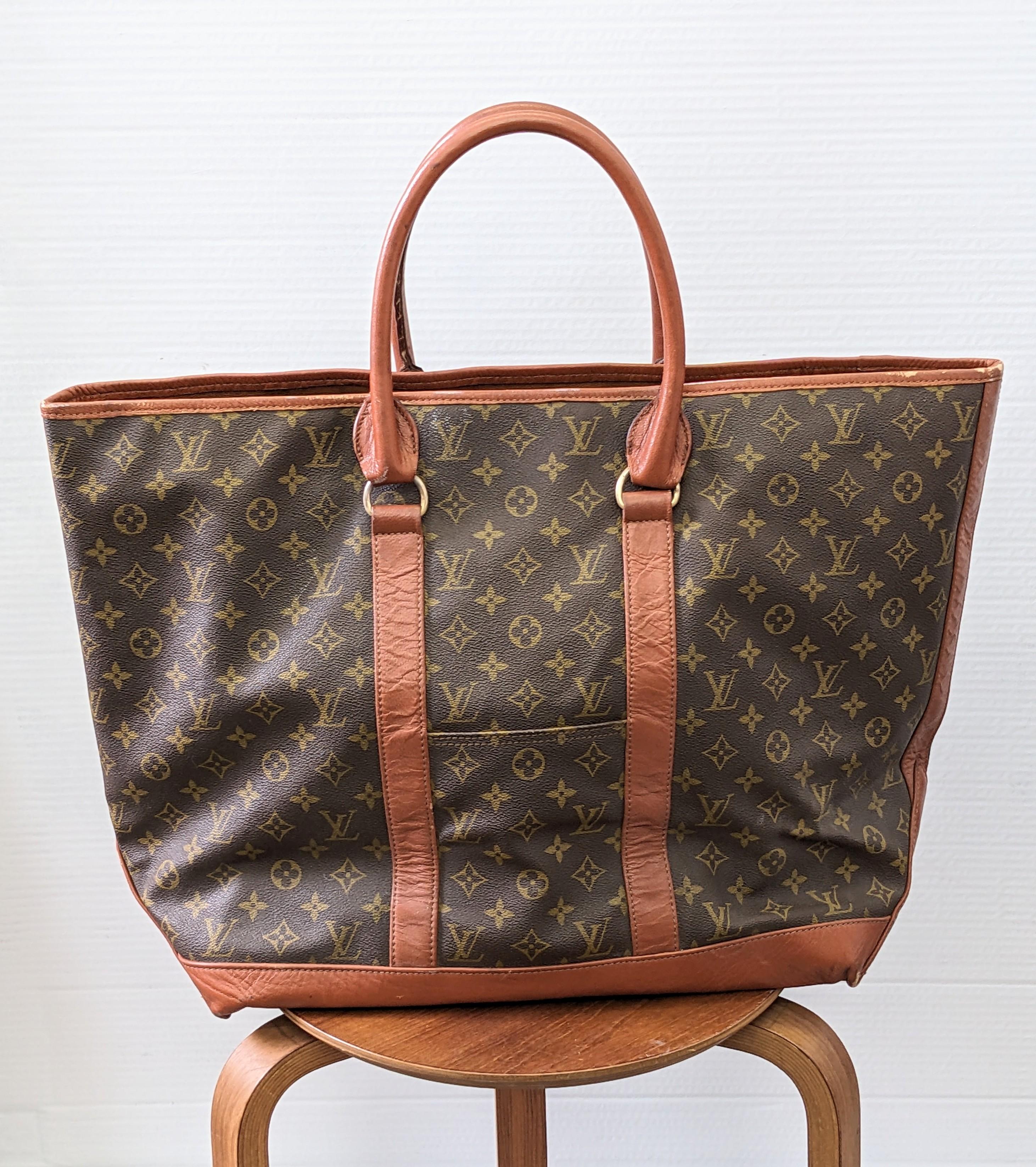 Chic, practical Louis Vuitton Sac Weekend GM in Monogram Canvas with Leather Trim from the 1980s. Unsigned, likely made by the French Co, a US collaboration with Vuitton in the period. Completely, fully leather lined Boat bag style, Great catchall