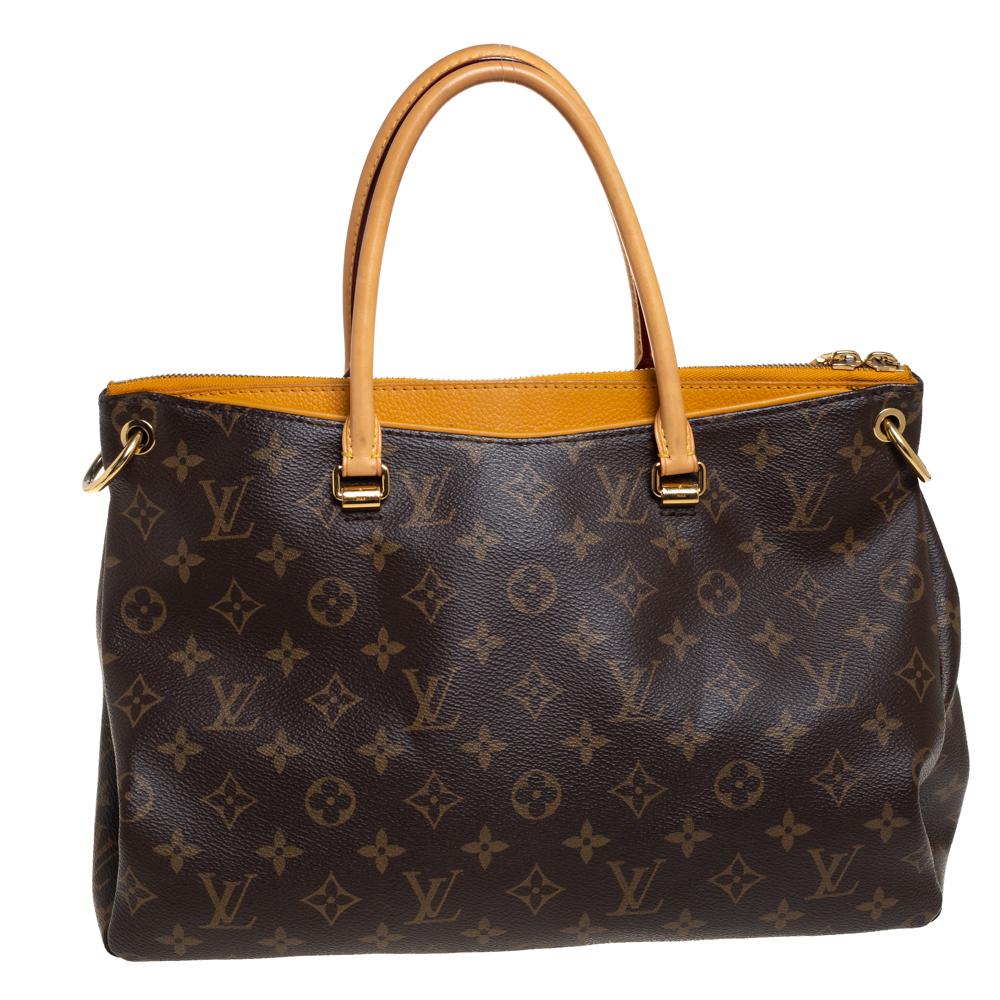 This Pallas bag by Louis Vuitton is perfect for every season. Its well-designed silhouette makes it practical and handy. Formed using signature monogram-coated canvas and saffron-hued leather, the bag has spacious compartments, two handles, and a