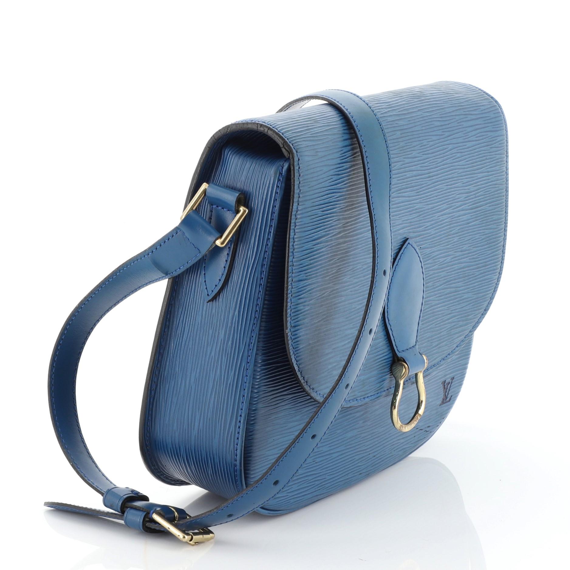 This Louis Vuitton Saint Cloud Handbag Epi Leather GM, crafted in blue leather, features exterior back pocket, an adjustable crossbody straps and gold-tone hardware. Its push-lock closure opens to a black leather interior with zipped pocket.