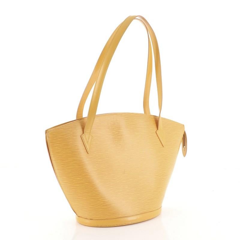 This Louis Vuitton Saint Jacques Handbag Epi Leather GM, crafted from yellow epi leather, features dual leather handles, subtle LV logo at the front, and gold-tone hardware. Its zip closure opens to a purple microfiber interior with side zip pocket.