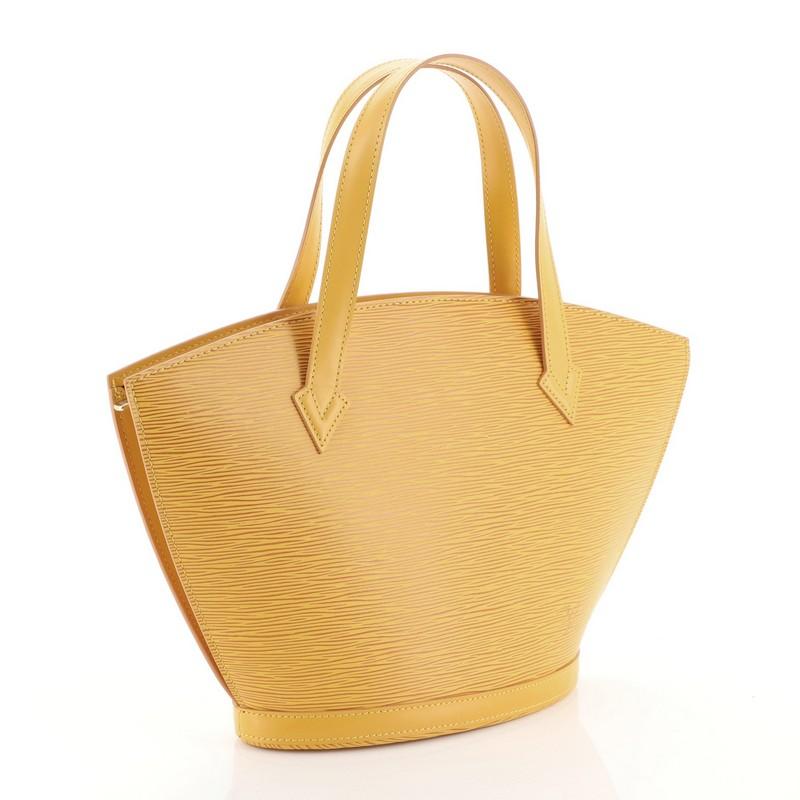 This Louis Vuitton Saint Jacques Handbag Epi Leather PM, crafted from yellow epi leather, features dual leather handles, subtle LV logo at the front, and gold-tone hardware. Its zip closure opens to a purple microfiber interior with side zip pocket.