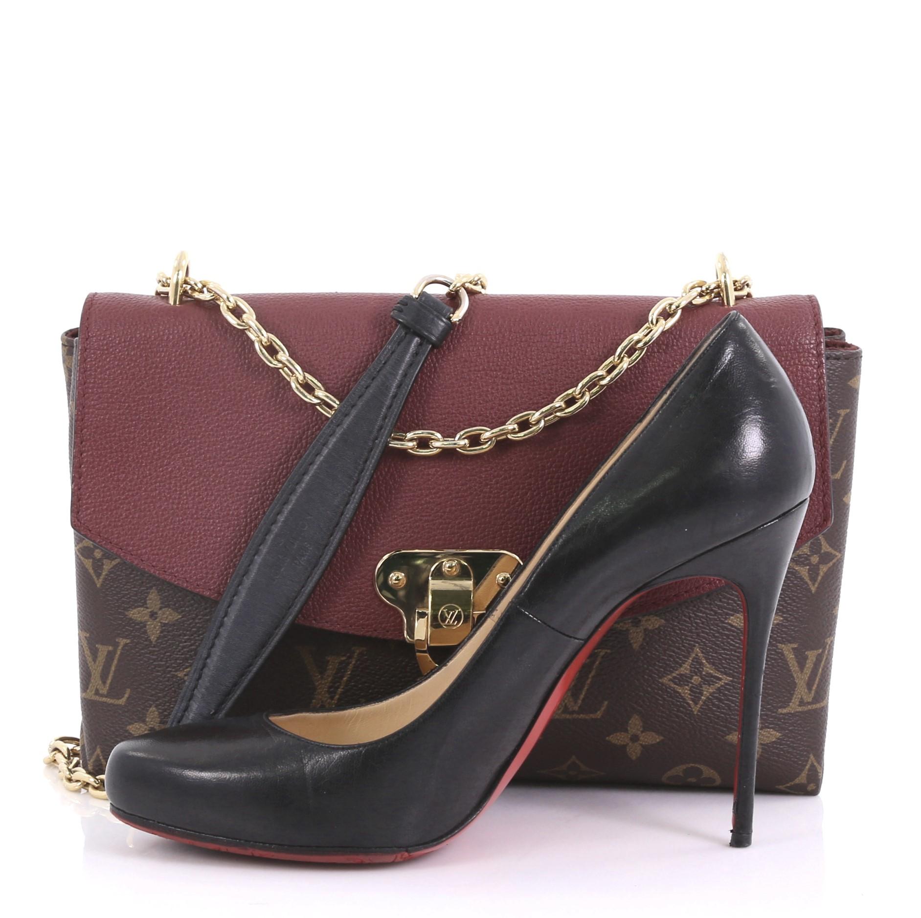 This Louis Vuitton Saint Placide Handbag Monogram Canvas and Leather, crafted in brown monogram coated canvas and burgundy leather, features a sliding chain-link shoulder strap with a leather pad and gold-tone hardware. Its flip-lock closure opens